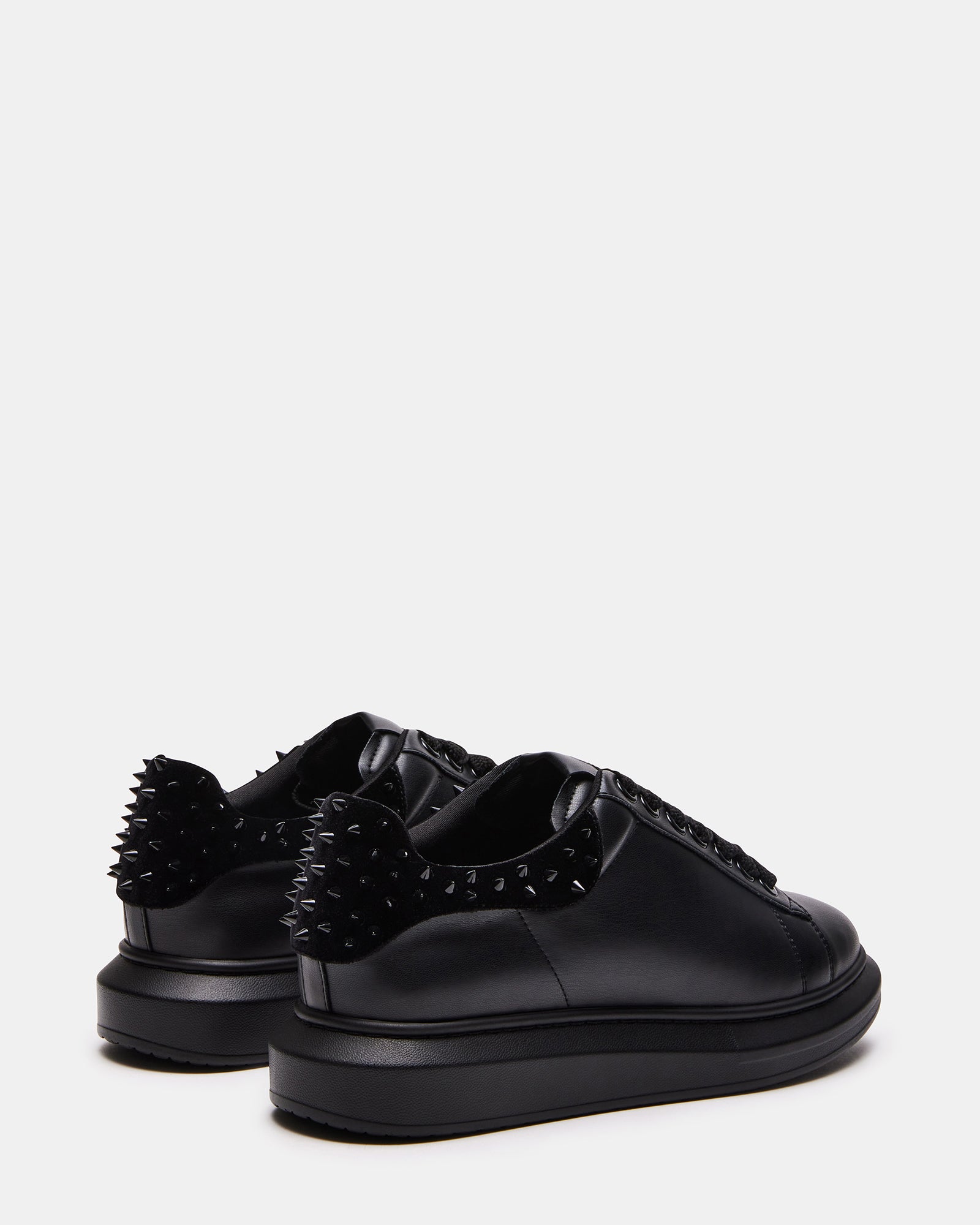 Close-up of the chunky rubber sole and spike details for streetwear fashion