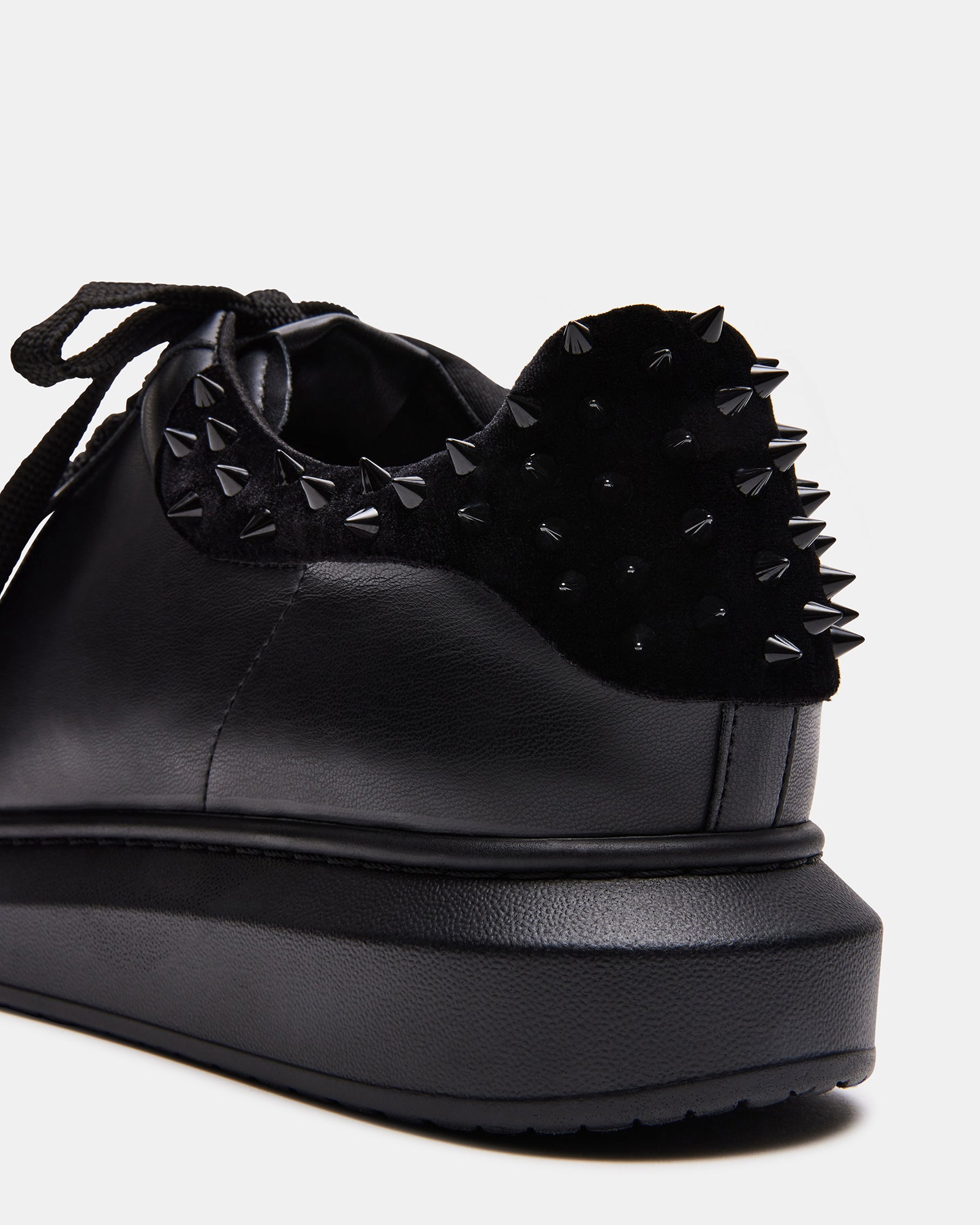 Side view of vegan Flatform Sneakers with spike accents on velvet upper