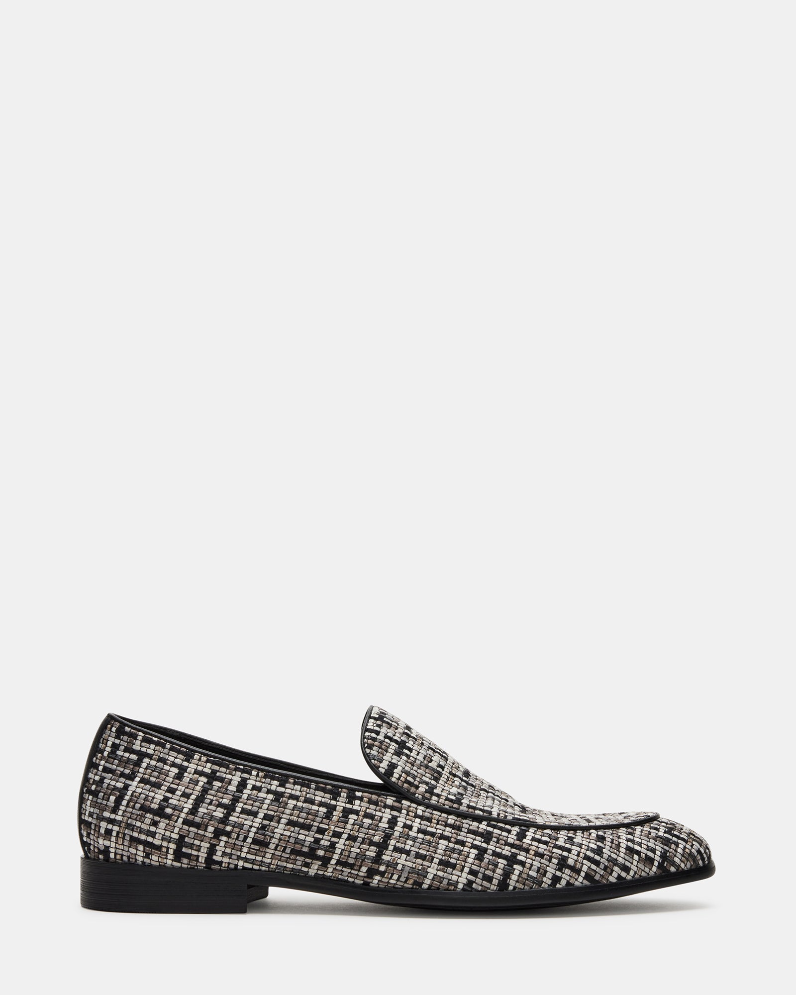 Galia black tweed loafers paired with a gray suit