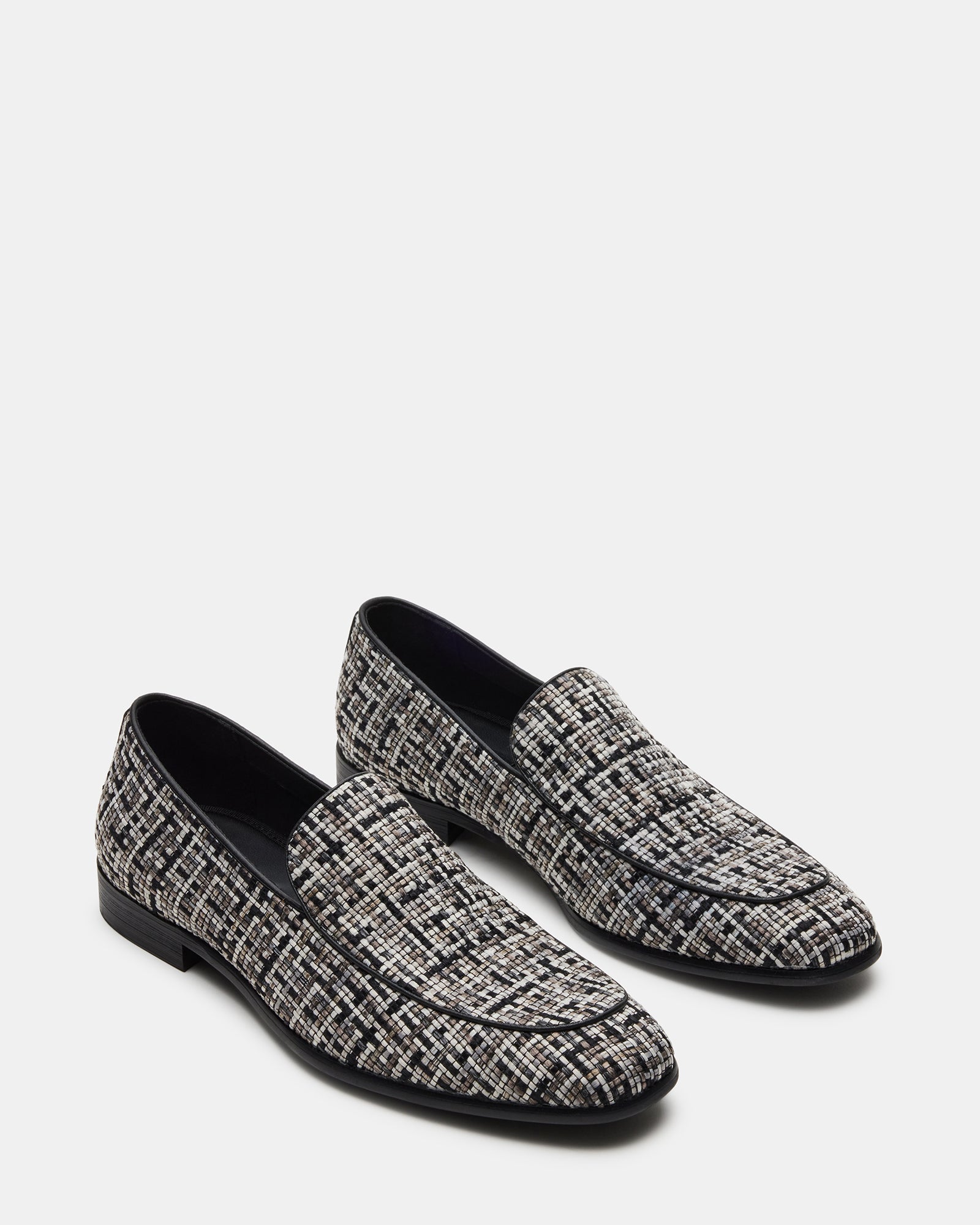 Close-up of woven fabric texture on slip-on formal shoes