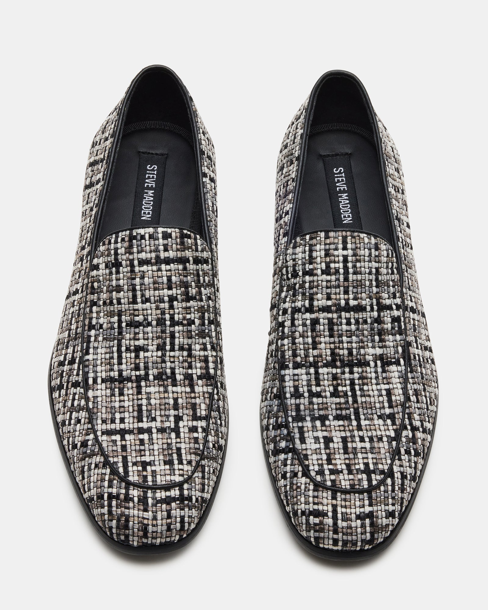 Galia black tweed loafers paired with a gray suit