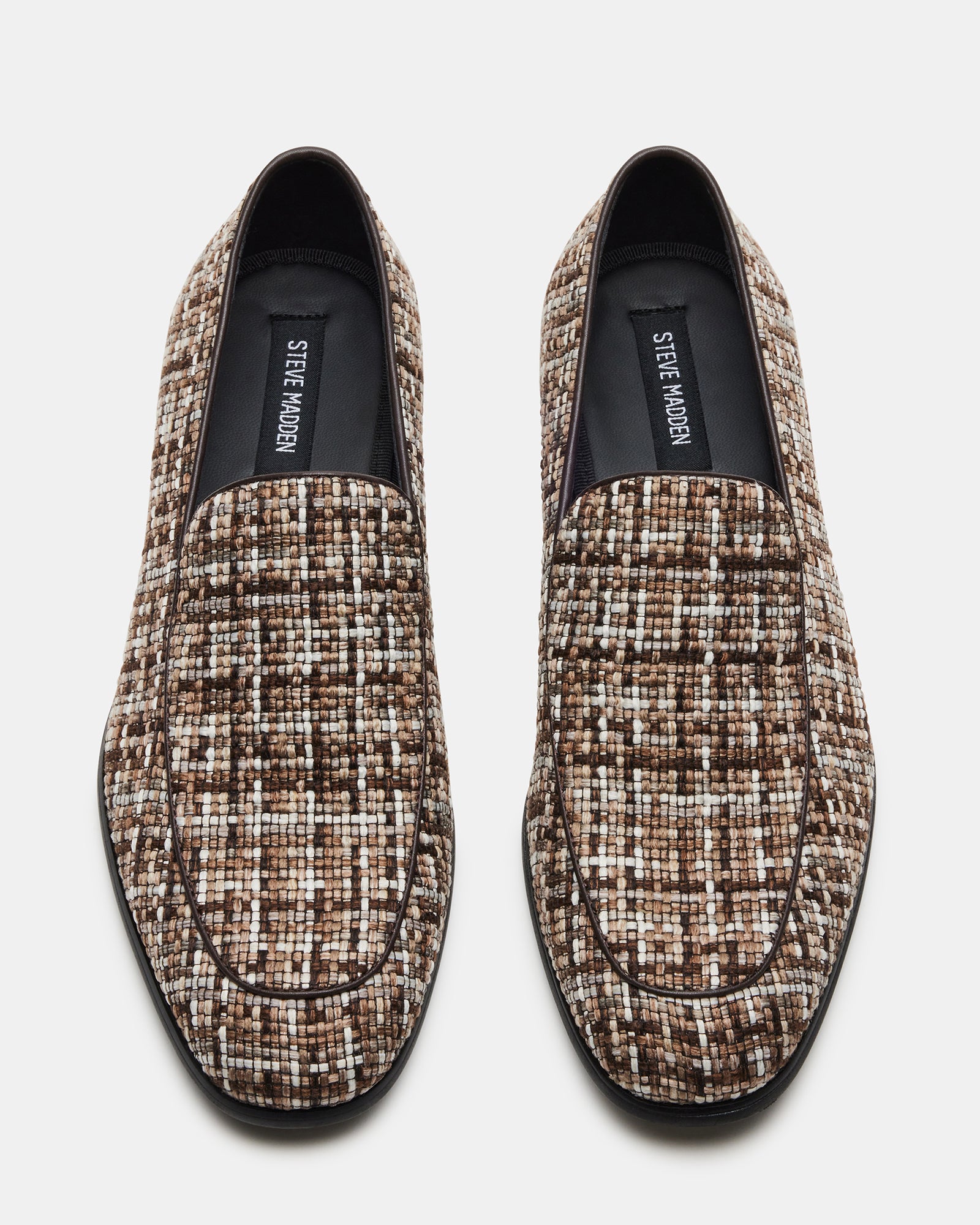 Side view of Galia brown tweed dress loafers styled with a navy suit