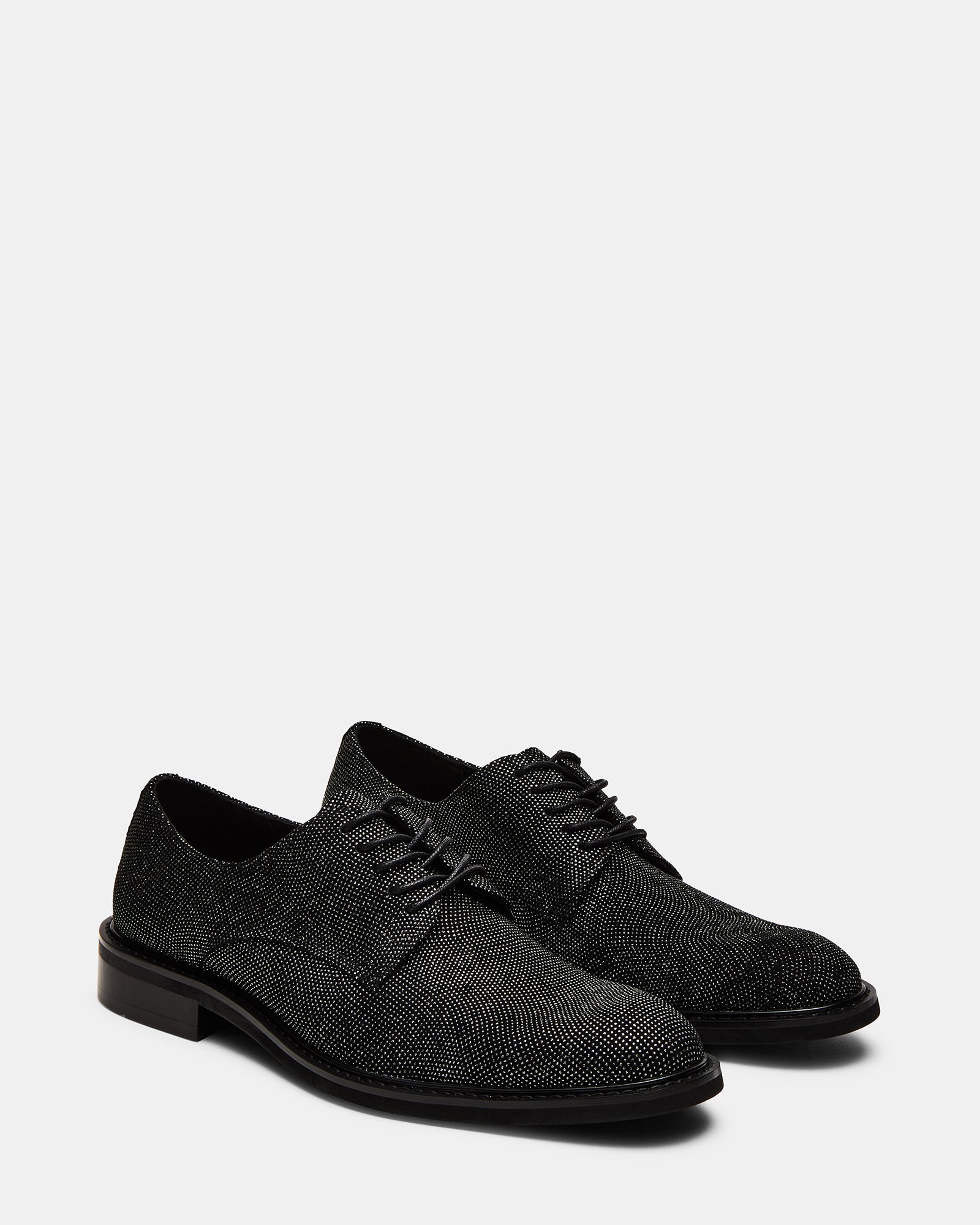Close-up of leather texture and lace-up design on mens dress shoes