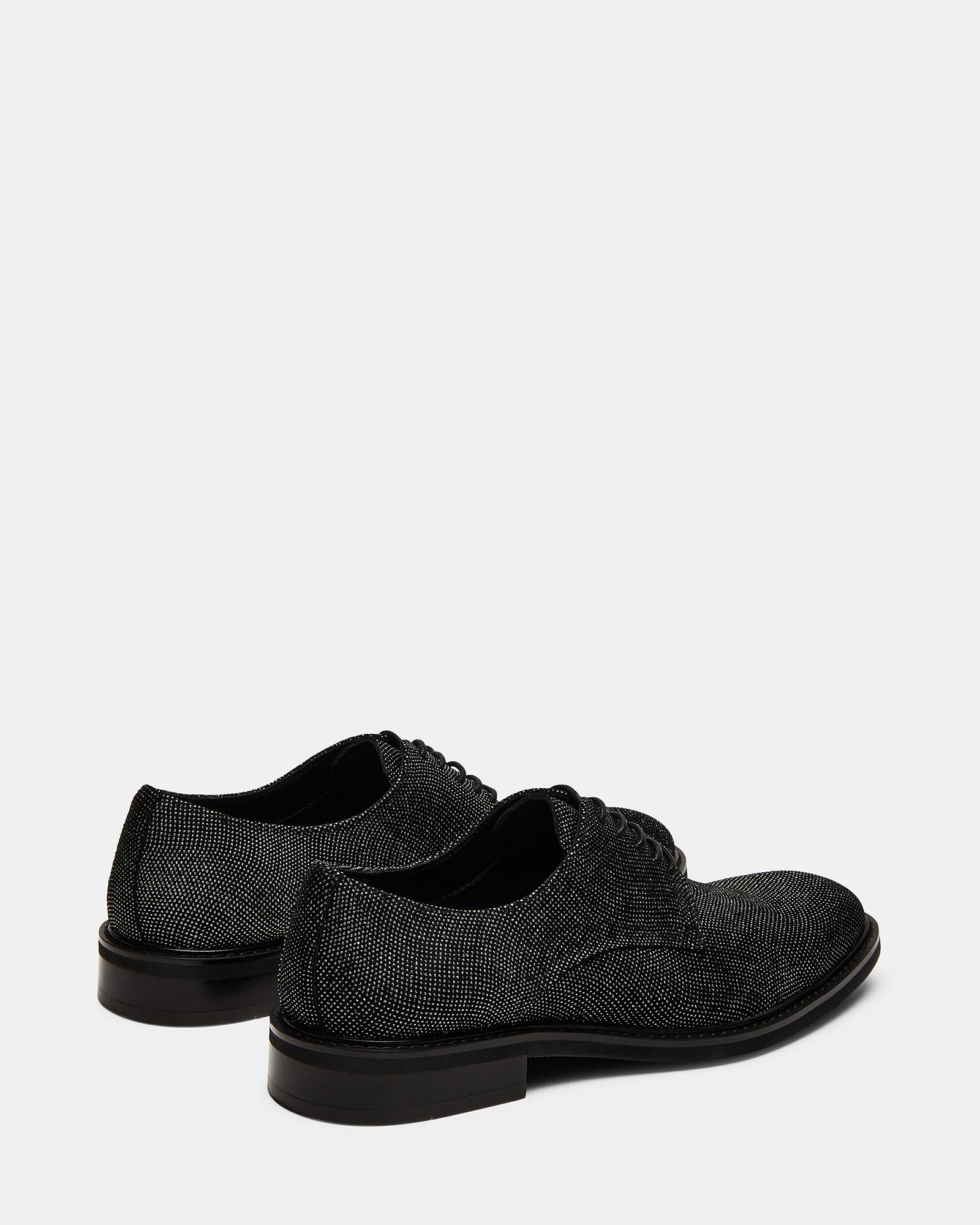 Close-up of leather texture and lace-up design on mens dress shoes