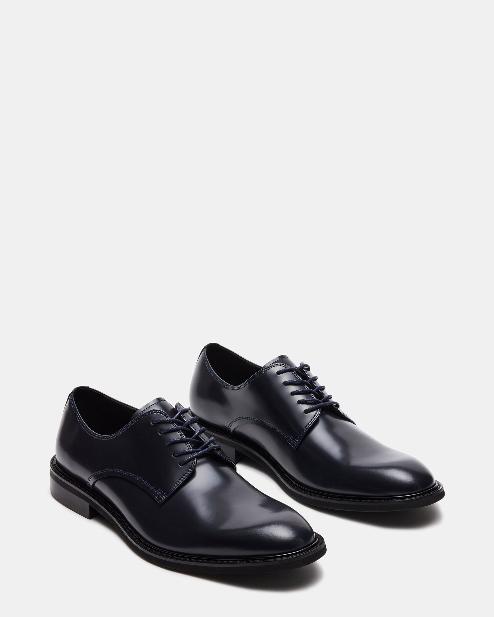 Hadar dress shoes paired with gray suit pants for formal occasion