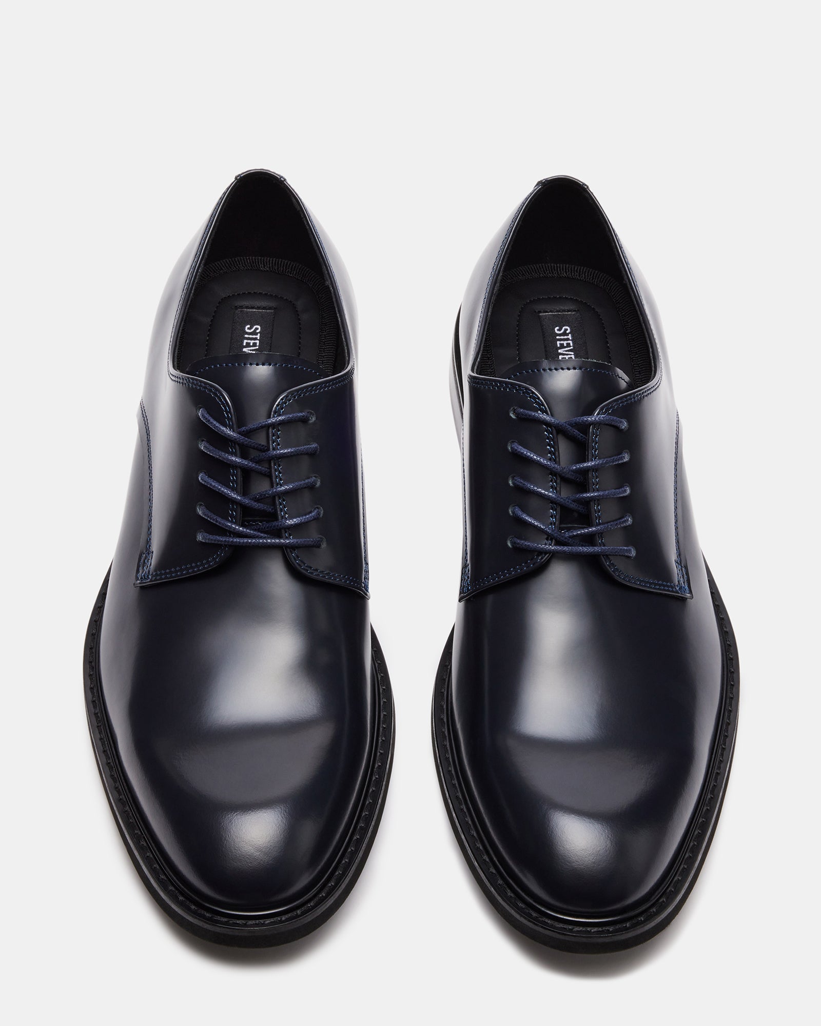 Hadar dress shoes paired with gray suit pants for formal occasion