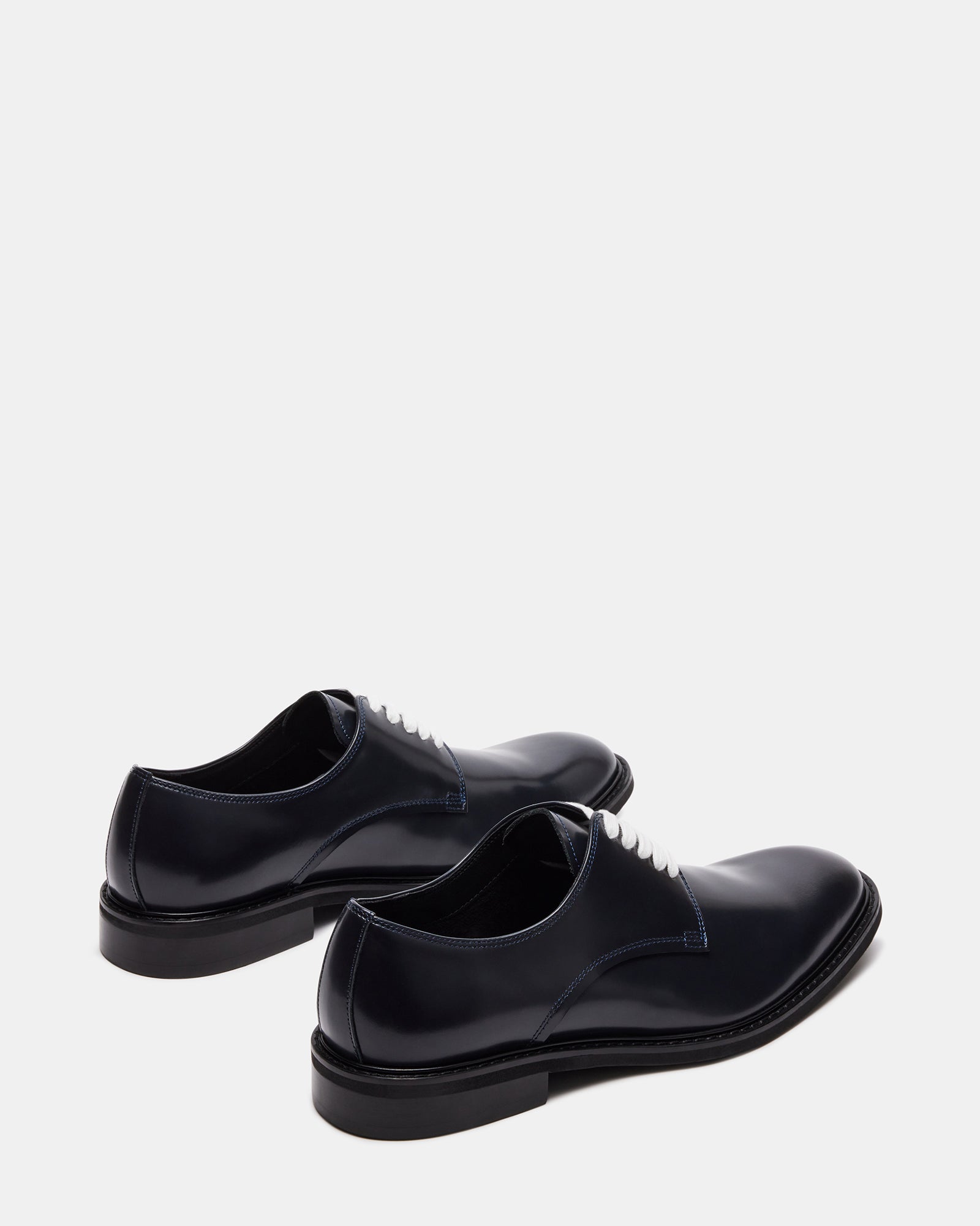 Hadar dress shoes paired with gray suit pants for formal occasion