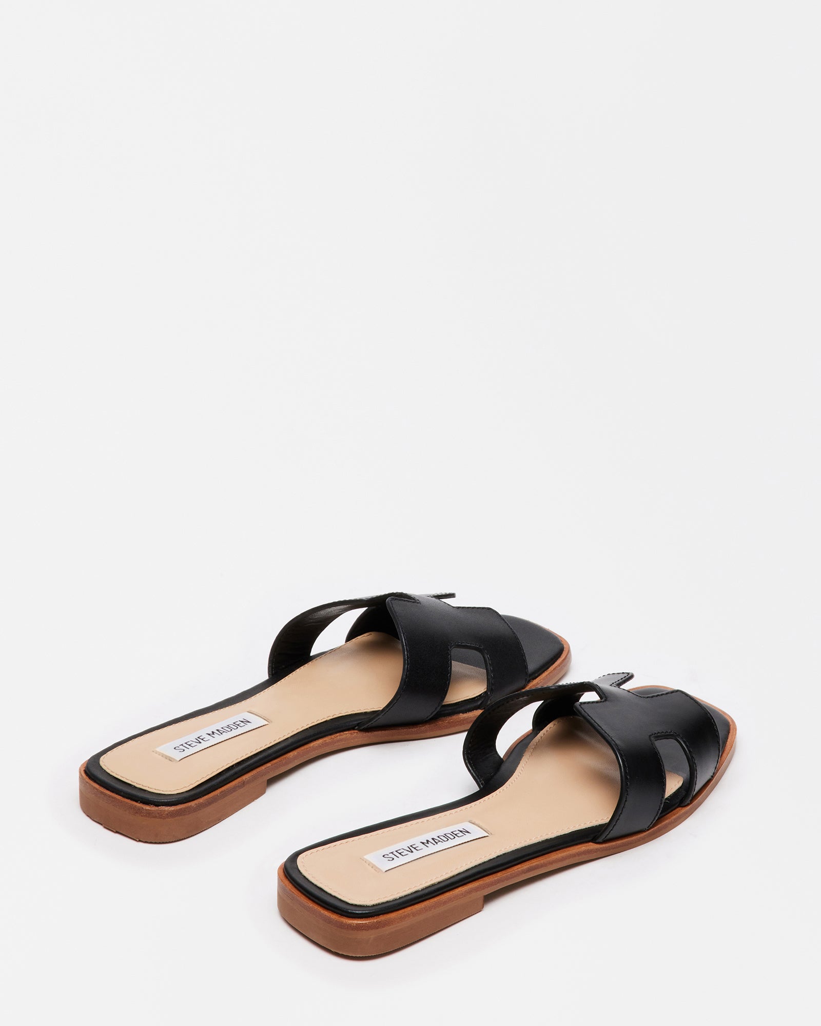 Lifestyle image of leather sandals for women styled with coastal outfit