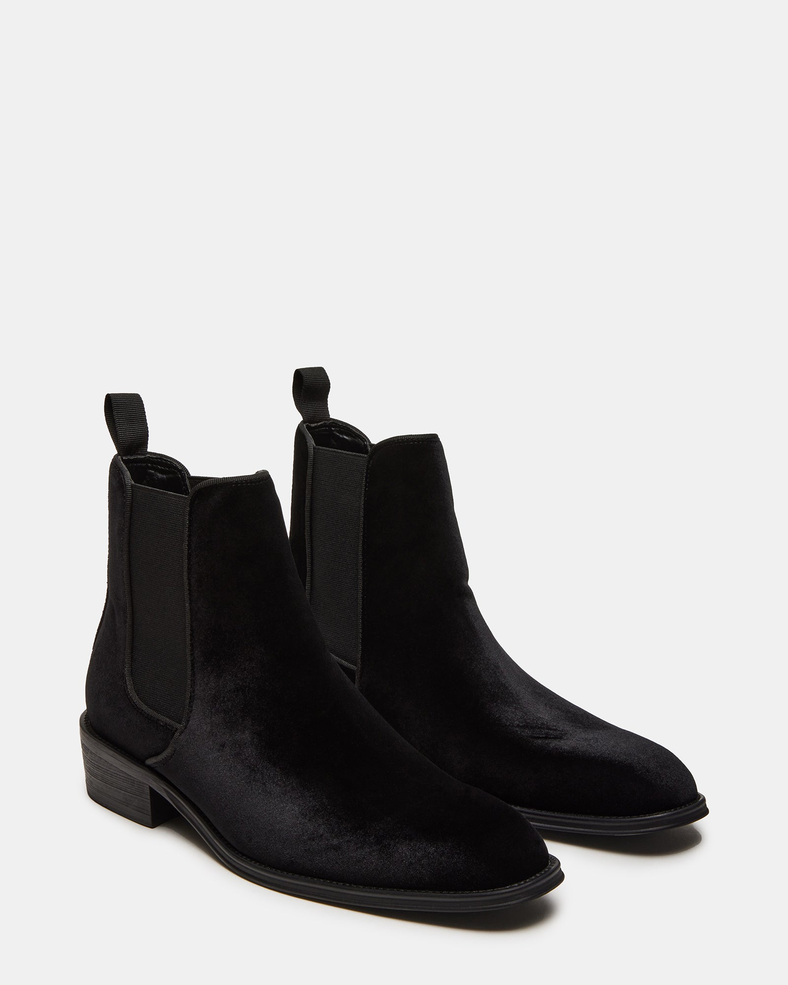 Close-up of elastic inset and heel pull tab on velvet Chelsea boots