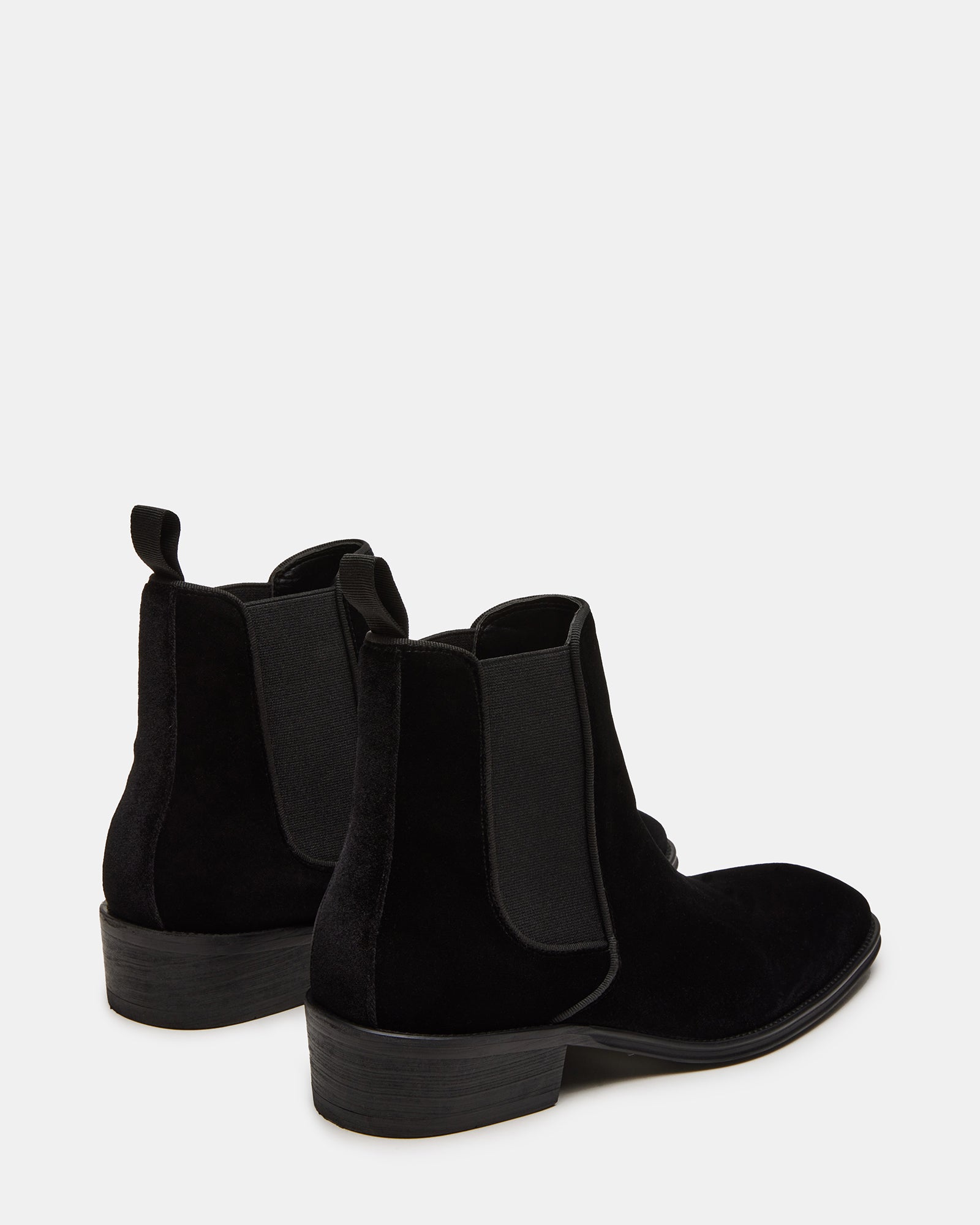 Close-up of elastic inset and heel pull tab on velvet Chelsea boots