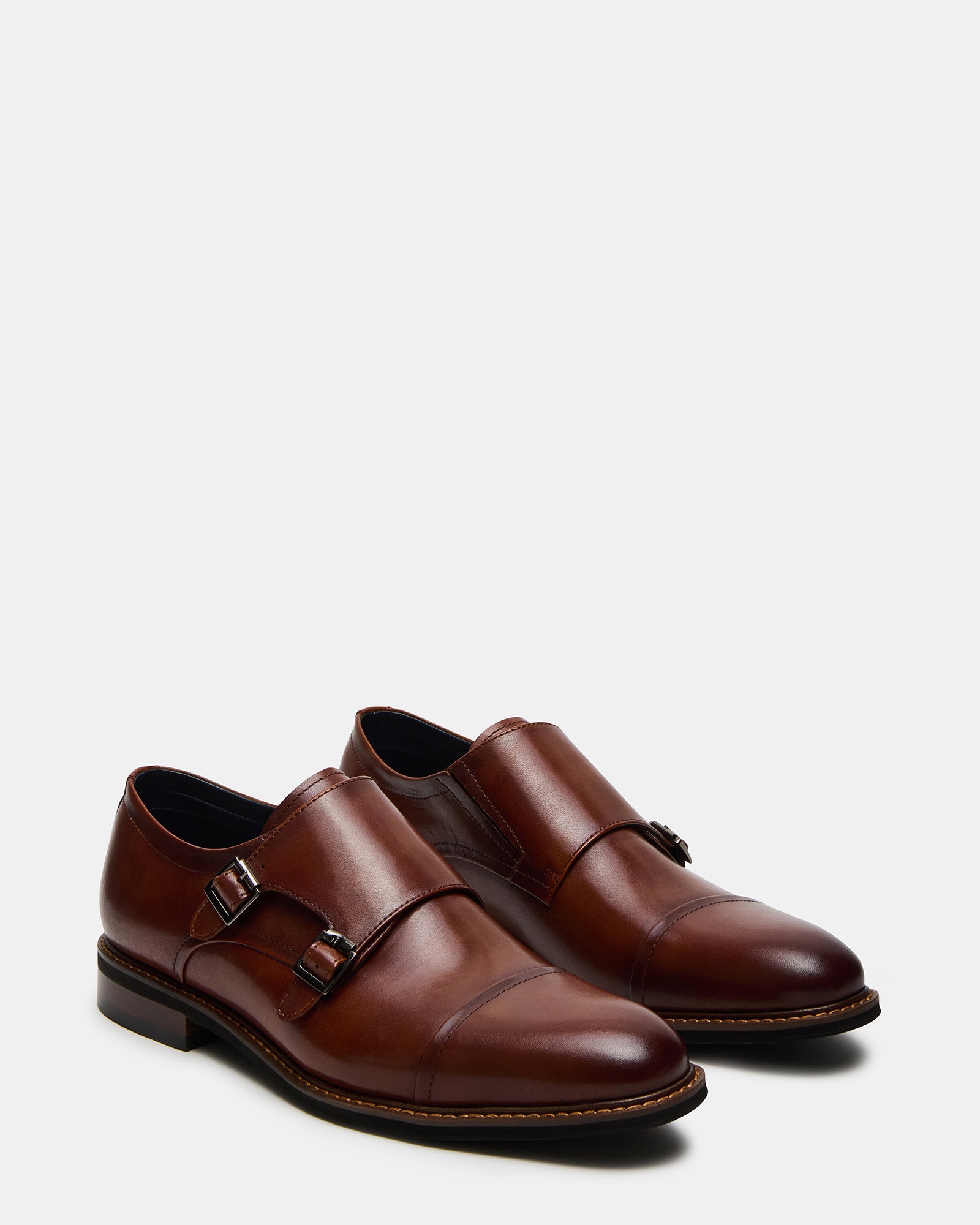 Sleek black formal shoes for men displayed with formal attire.