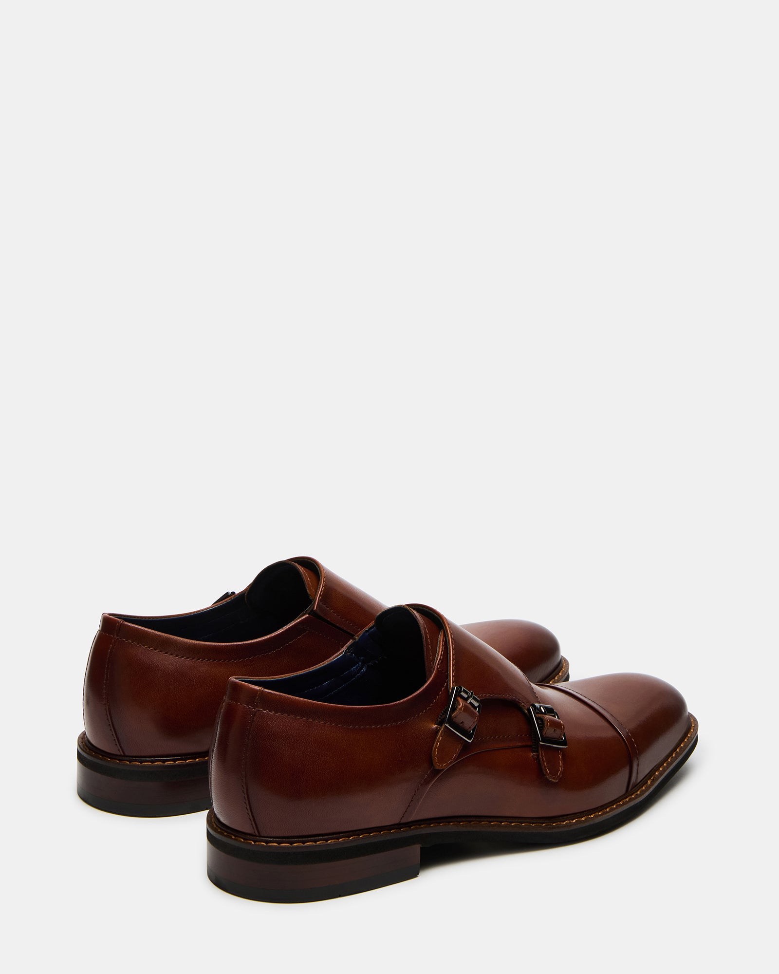Sleek black formal shoes for men displayed with formal attire.