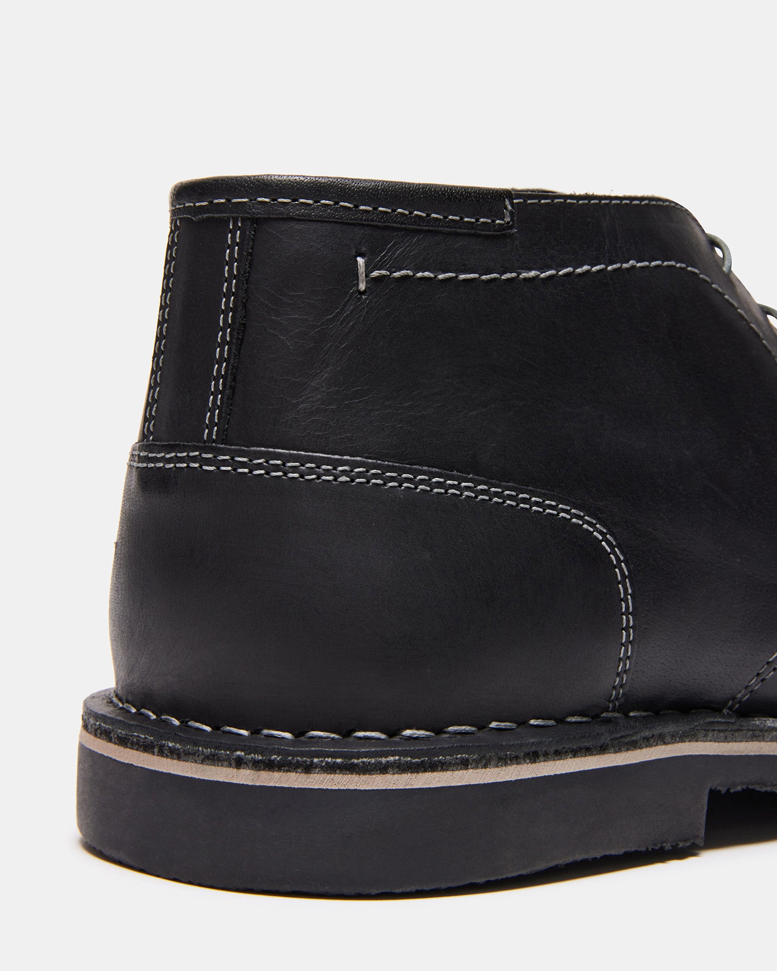 Top-down angle of chukka boots women version with khaki trousers.