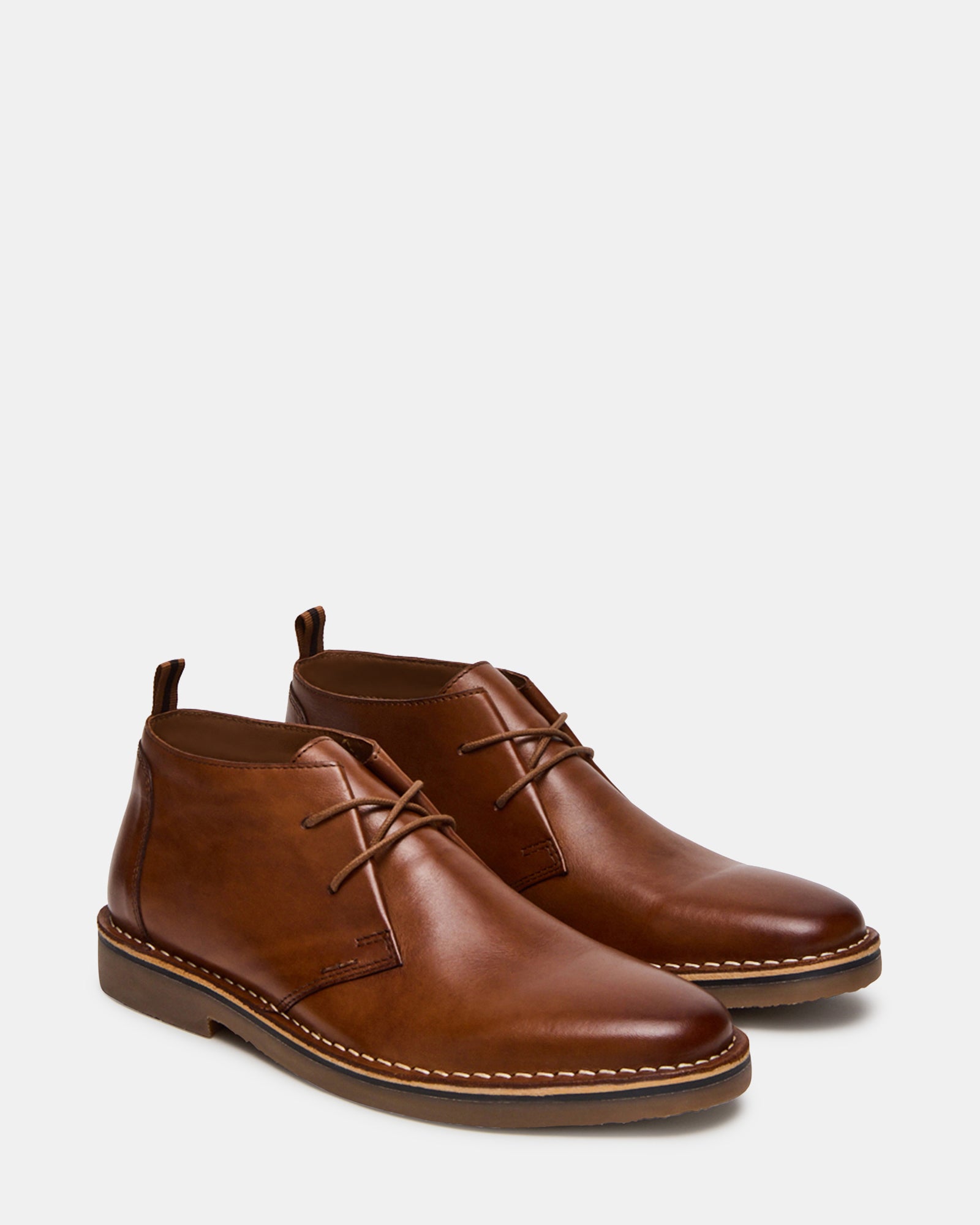 Tan leather boots paired with denim for casual wear