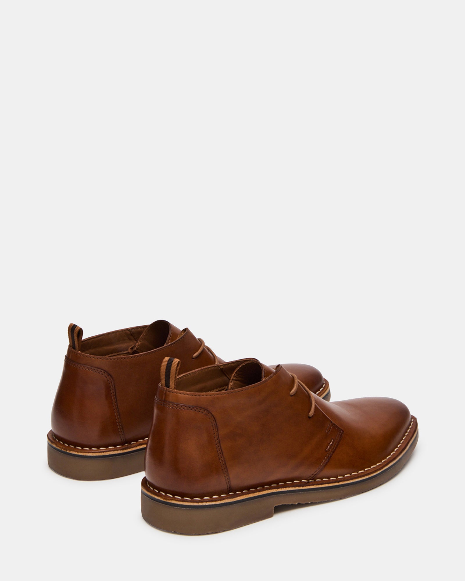 Tan leather boots paired with denim for casual wear