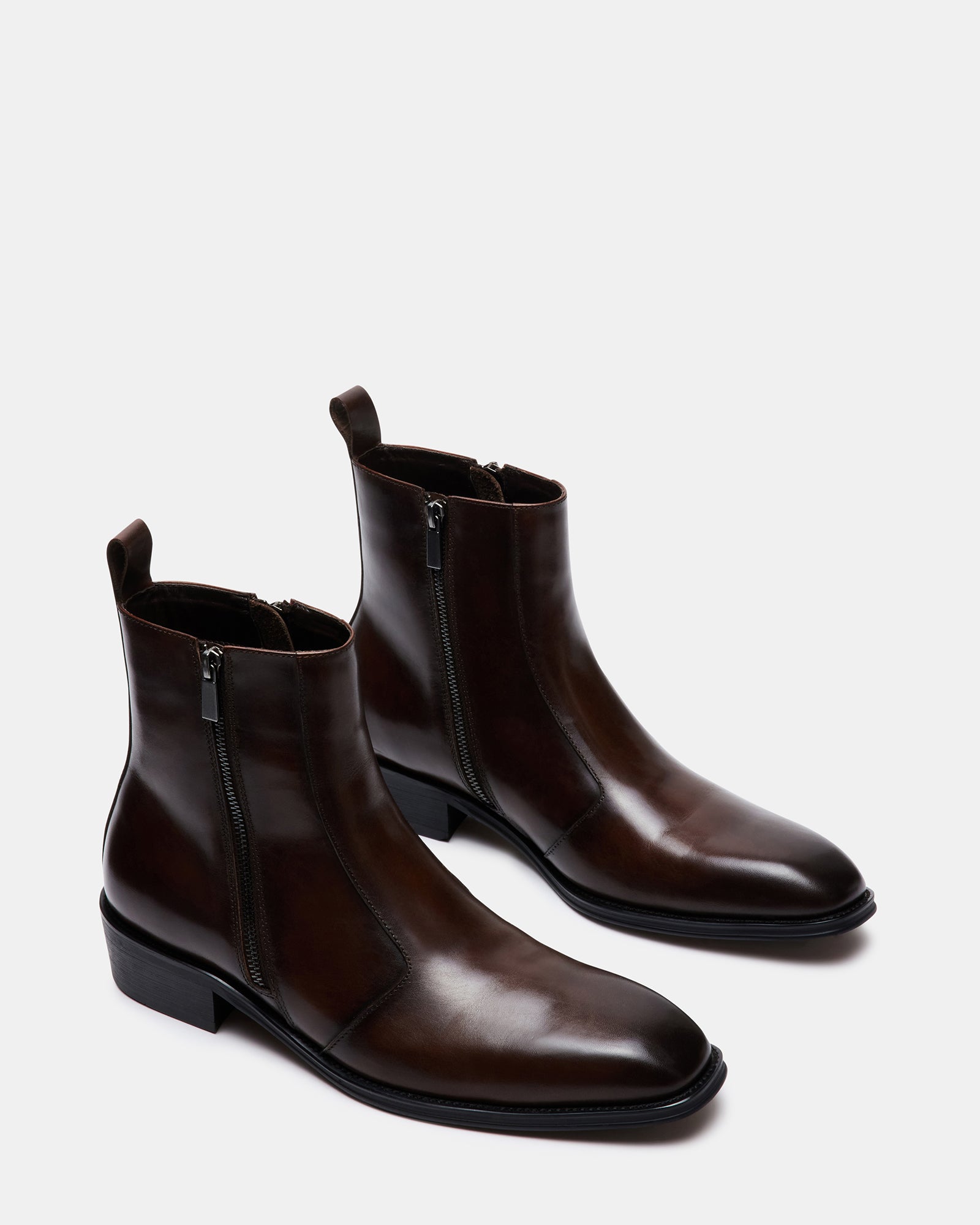 Close-up of the double zipper detail on the mens brown leather boots.