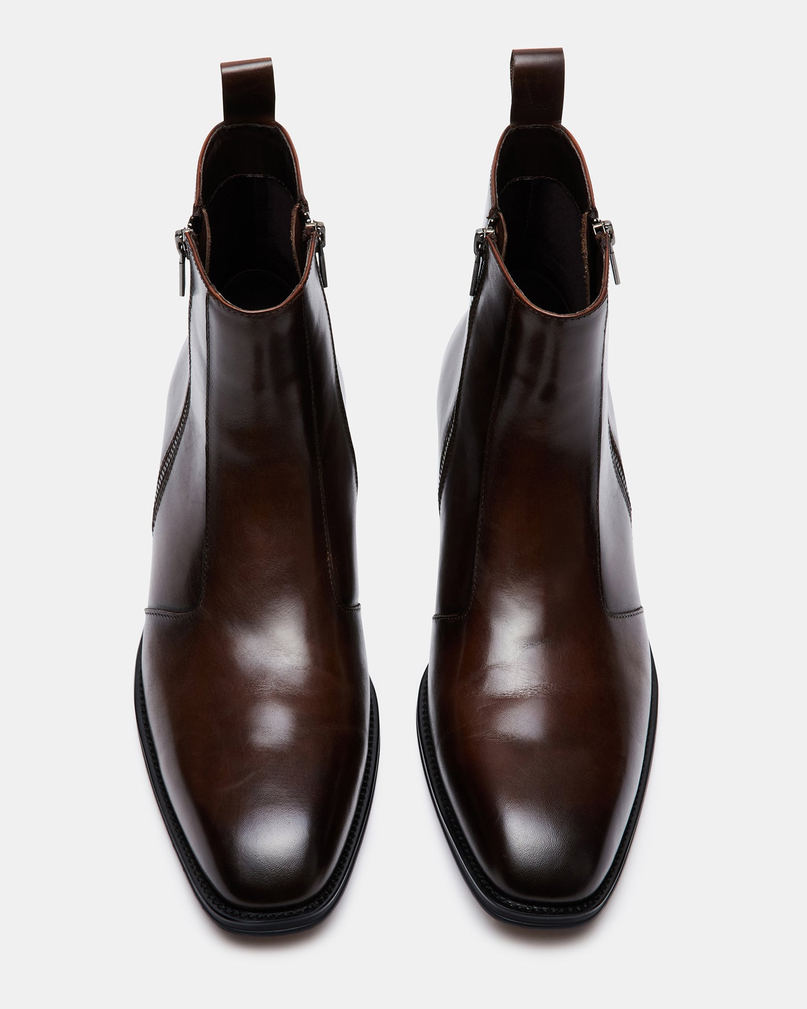 Side angle of brown leather ankle boots highlighting the block heel.