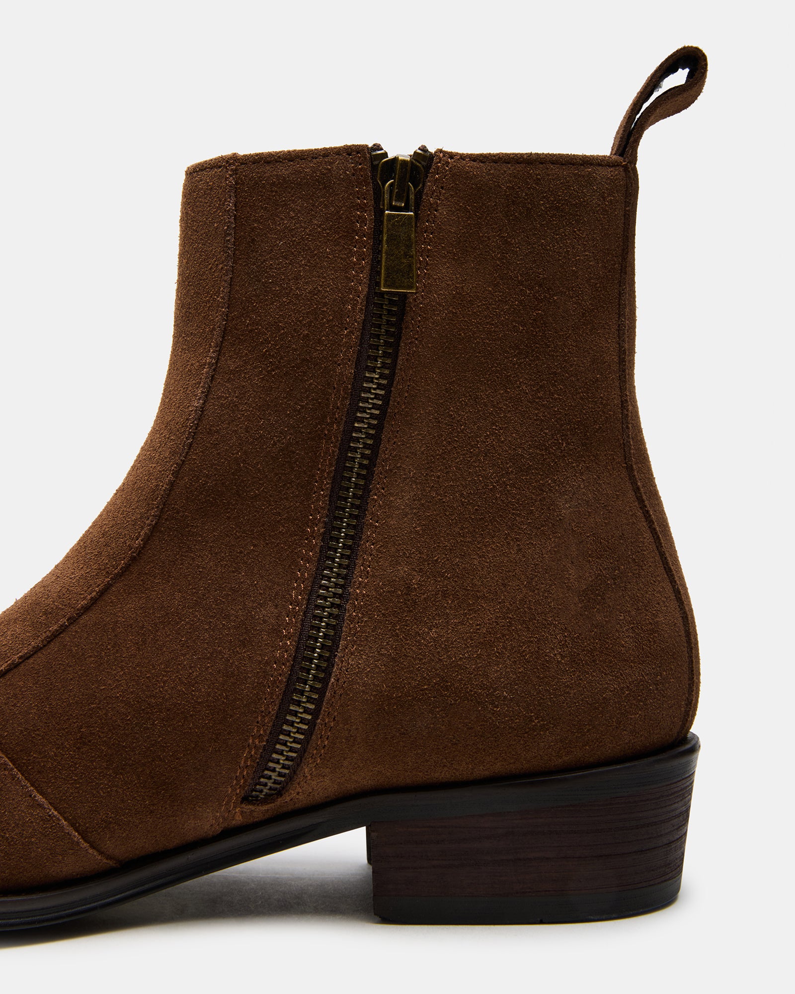 Side view of brown suede dress boots showcasing double zipper design.