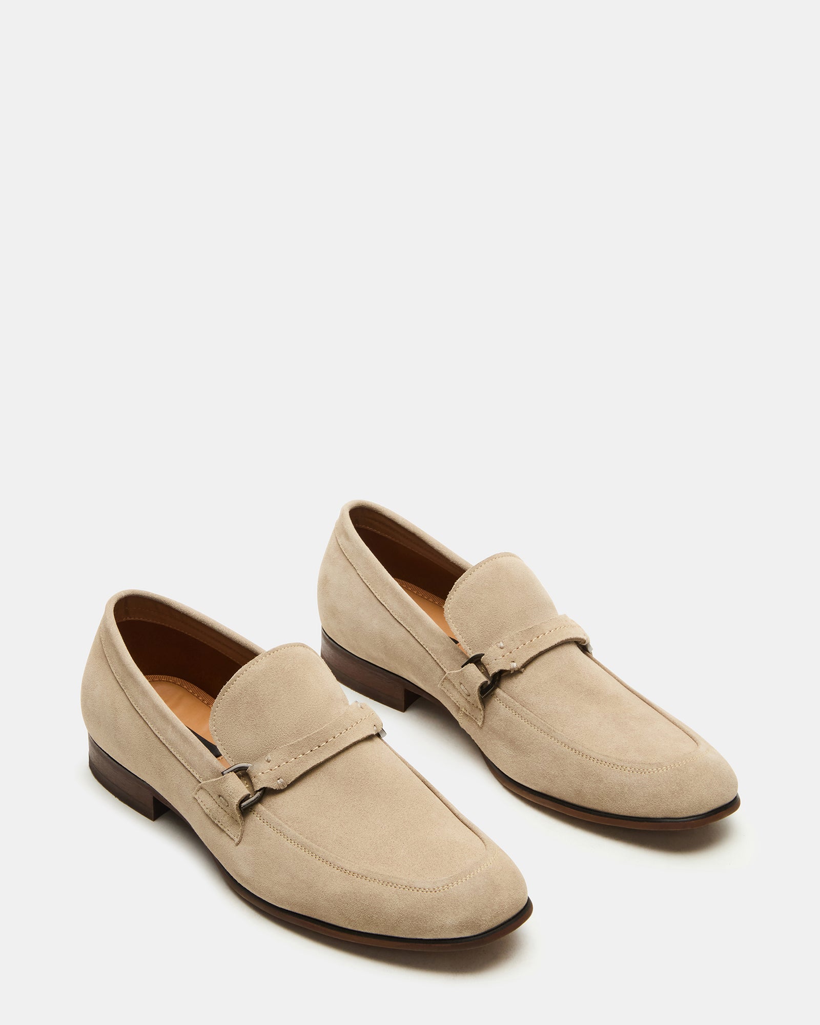 Brown suede loafers styled with casual outfit for urban wear