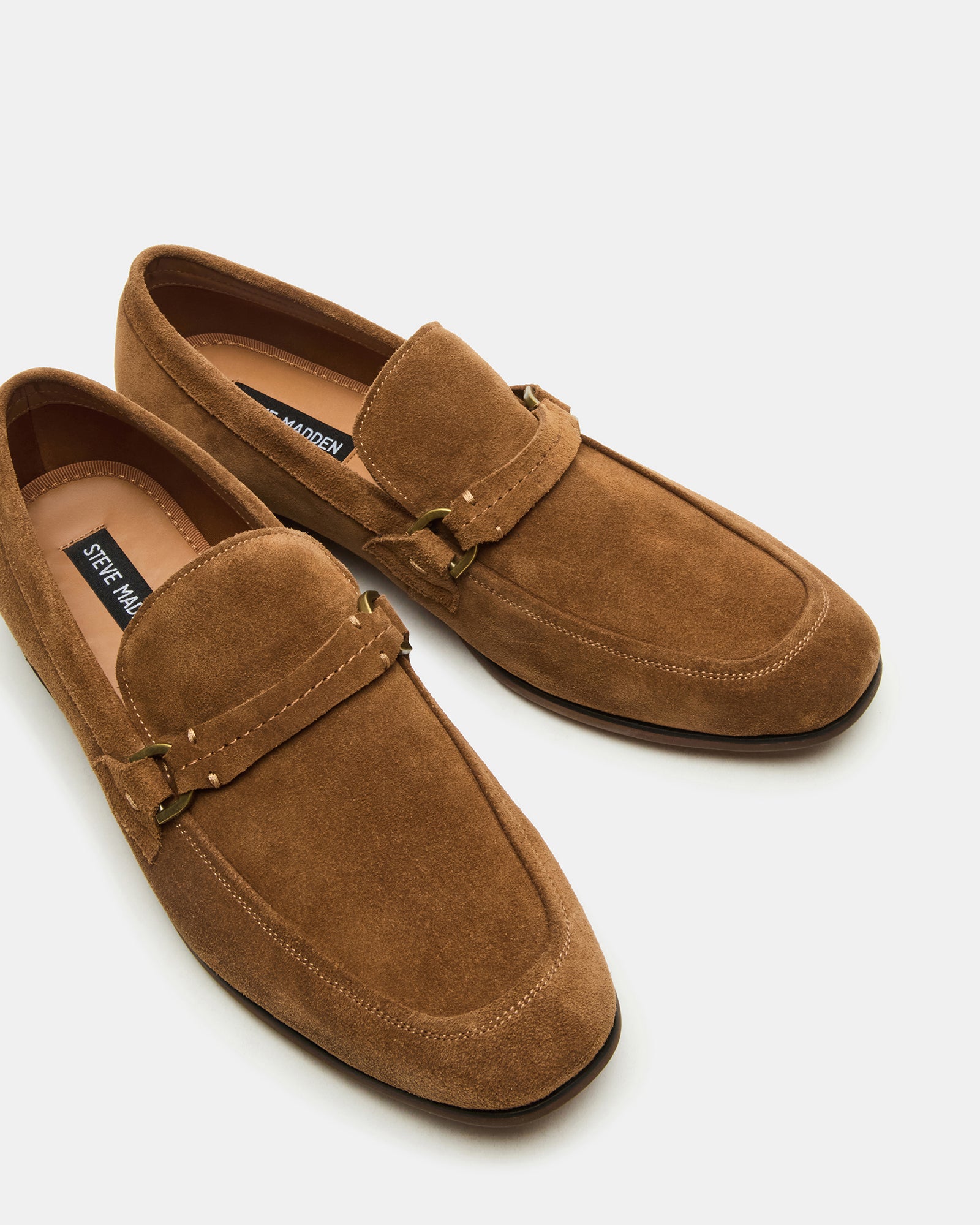 Stylish outfit pairing featuring HEROLF suede shoes with dark denim for a smart-casual look.