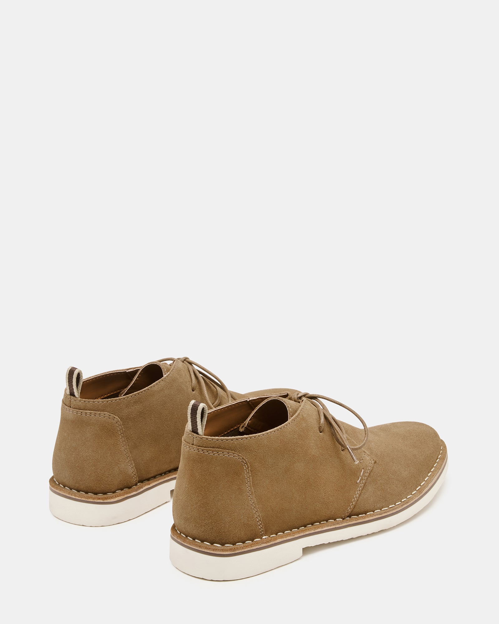 HERO cognac suede ankle boots styled with casual attire outdoors.