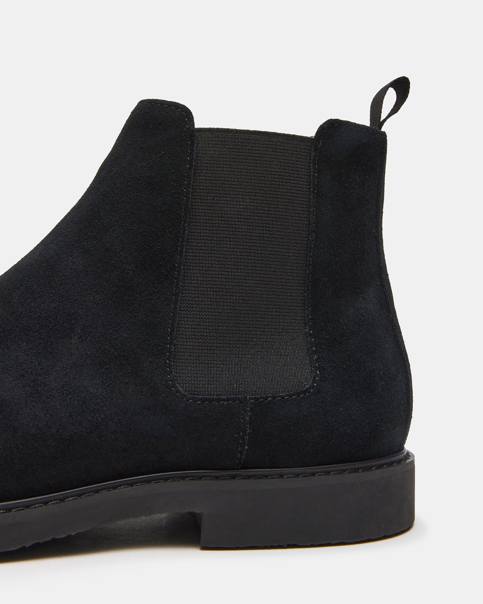 Back view of the Highline black suede boots highlighting the heel.
