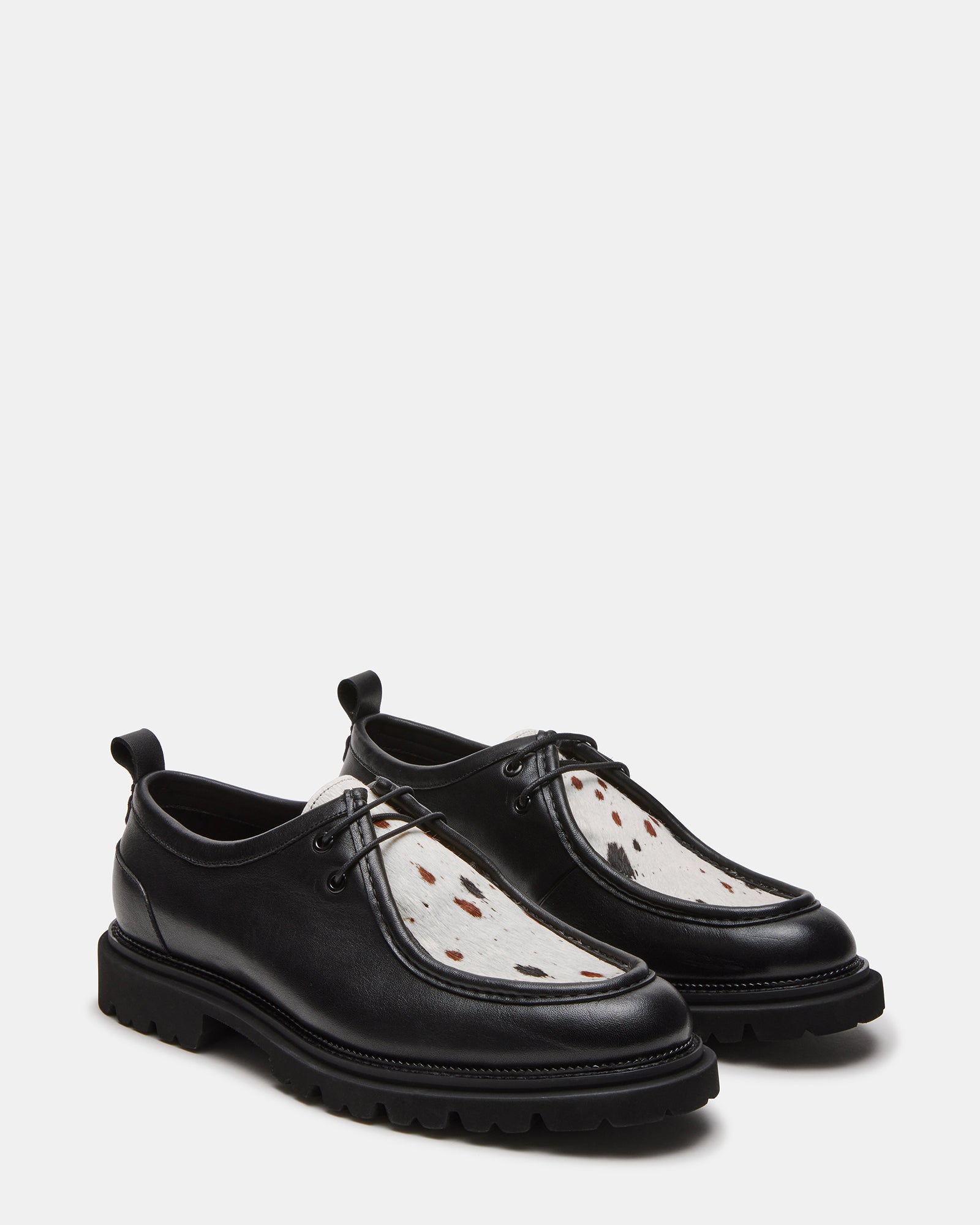 Side profile showing the 1.25-inch heel and textured rubber sole of these dress shoes