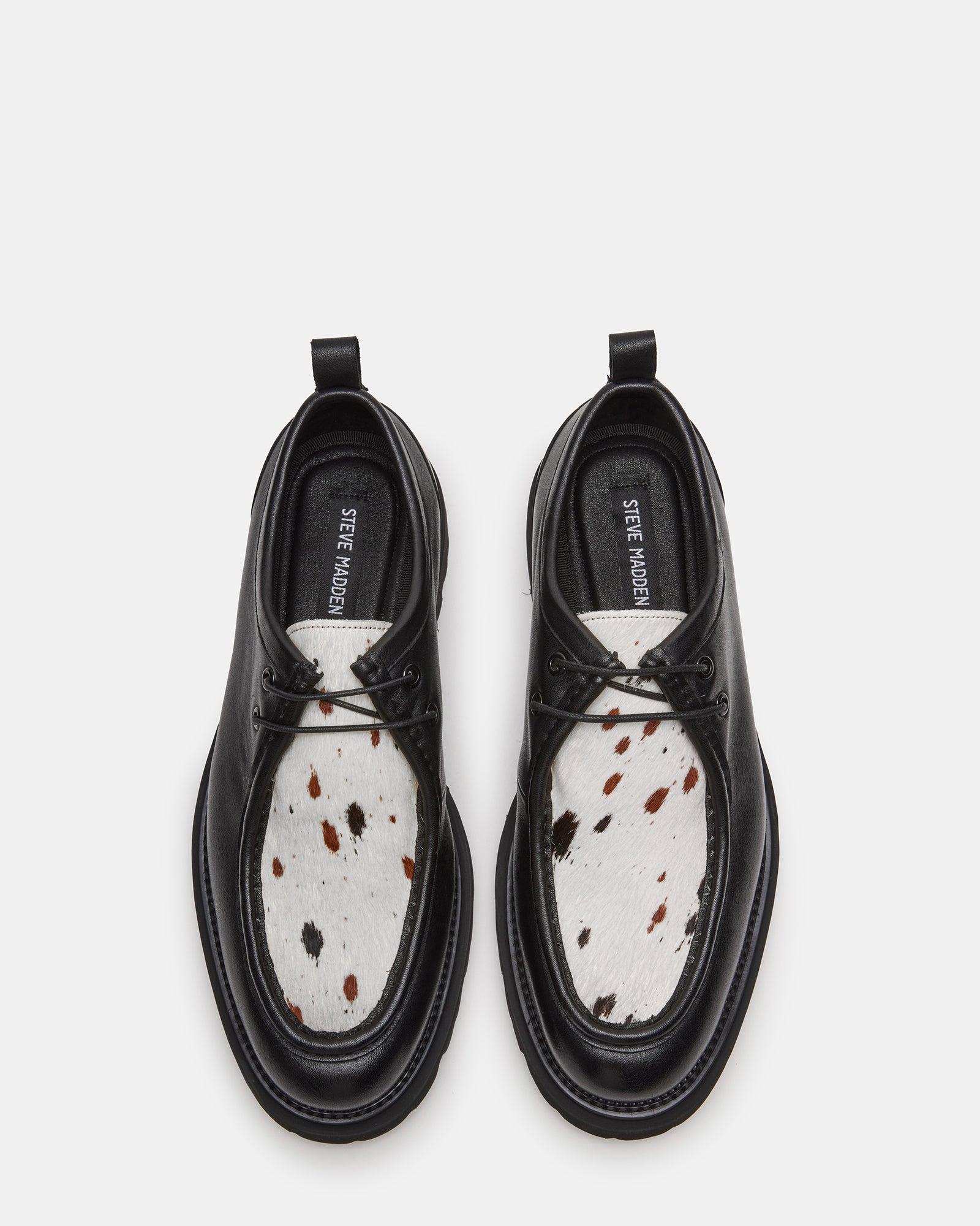Front view of black patent leather shoes with polished toe cap and lace-up design