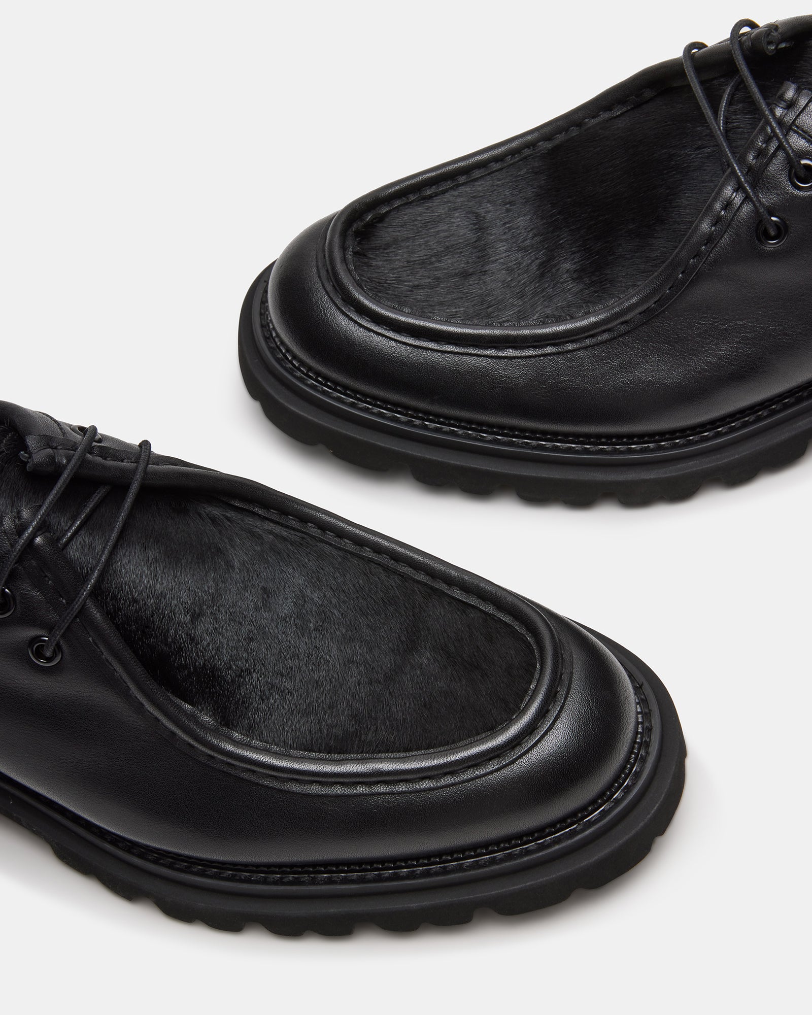 Mens oxford shoes on display against a hardwood floor – perfect for upscale events