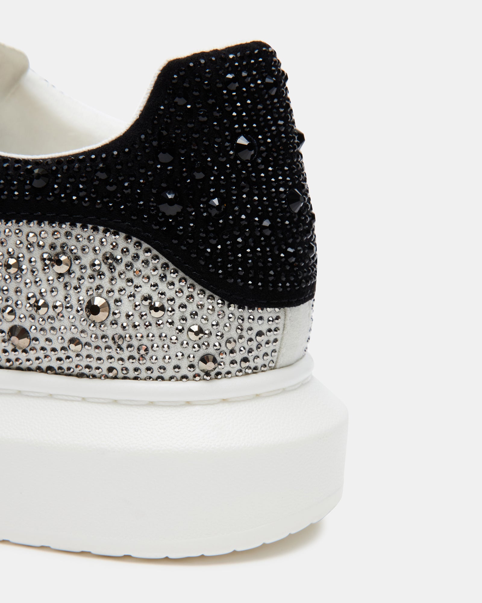 Side view of Icebox silver rhinestone platform sneakers highlighting the wide beveled sole