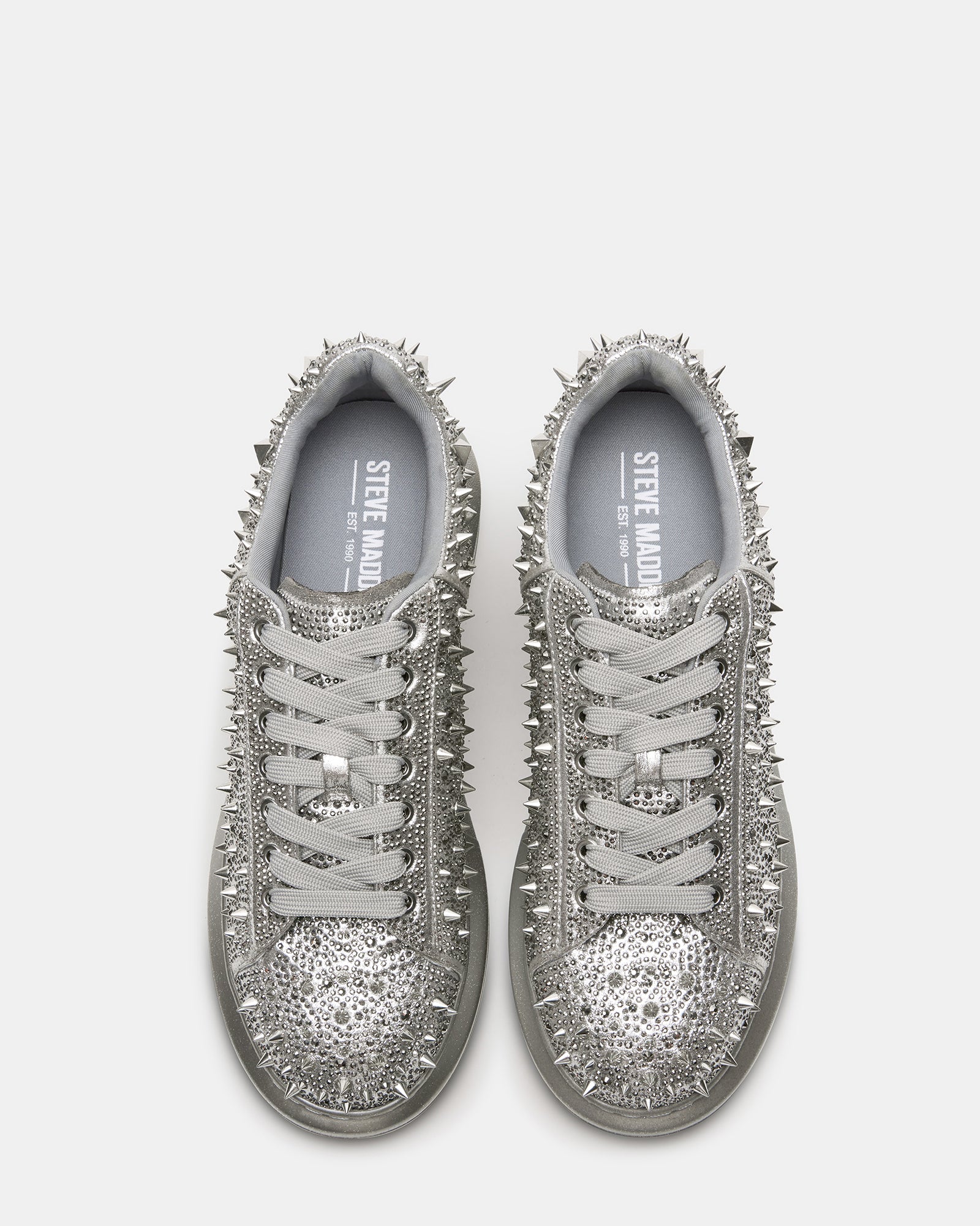 Top view of metallic bling sneakers with lace-up closure and gemstone detailing.