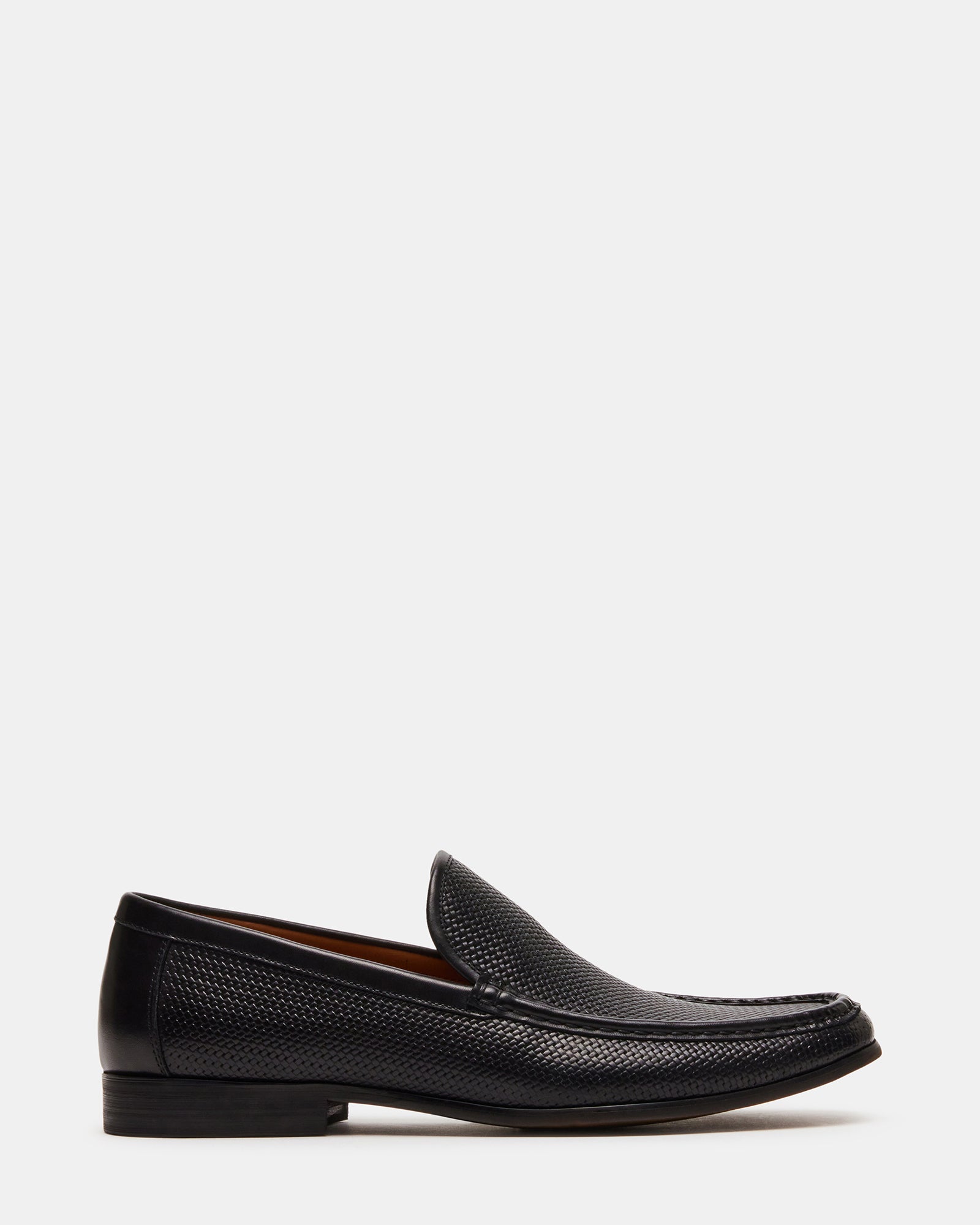 Black dress loafers shown at 45-degree angle on hardwood floor