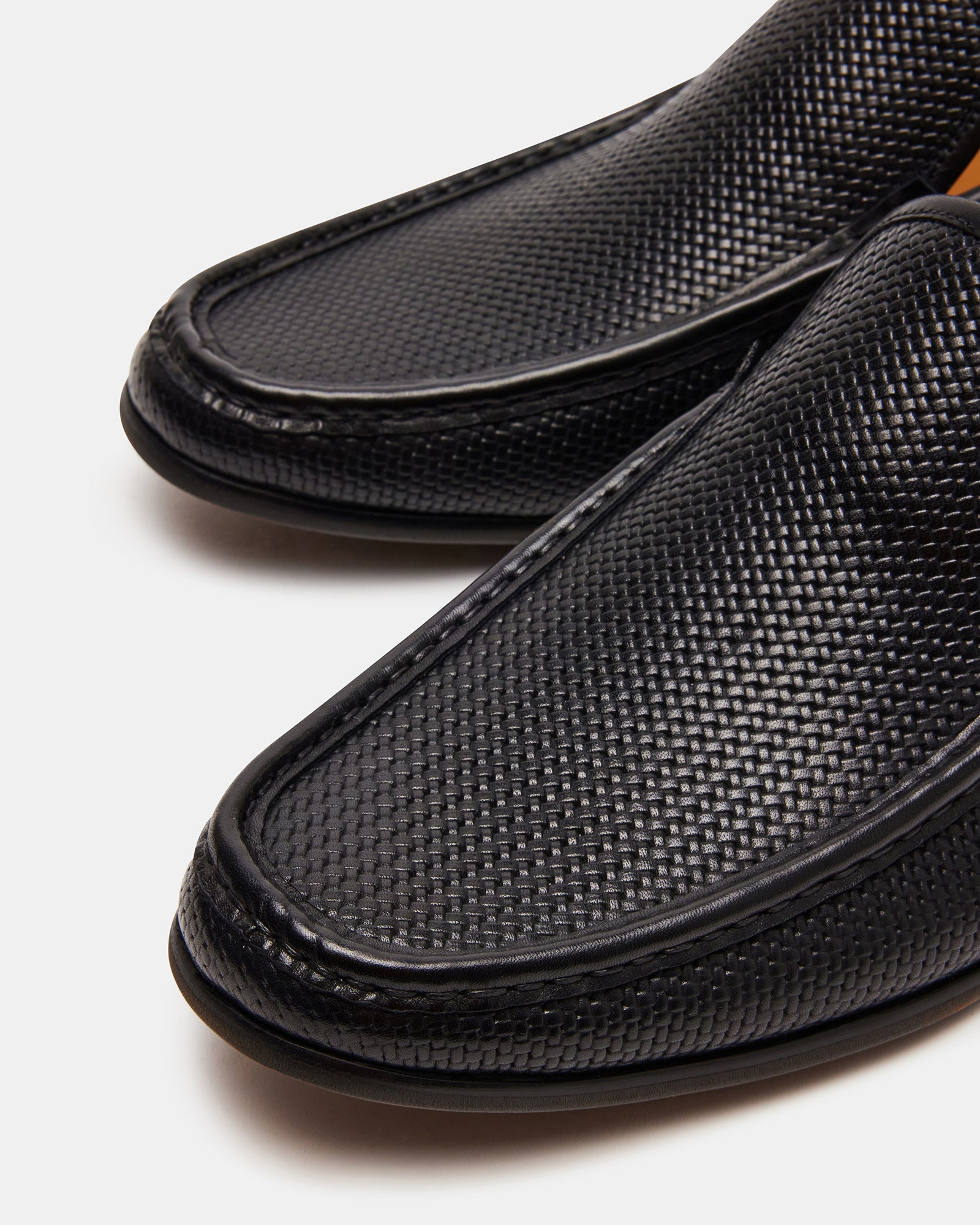 Stylish slip-on shoes paired with gray dress pants