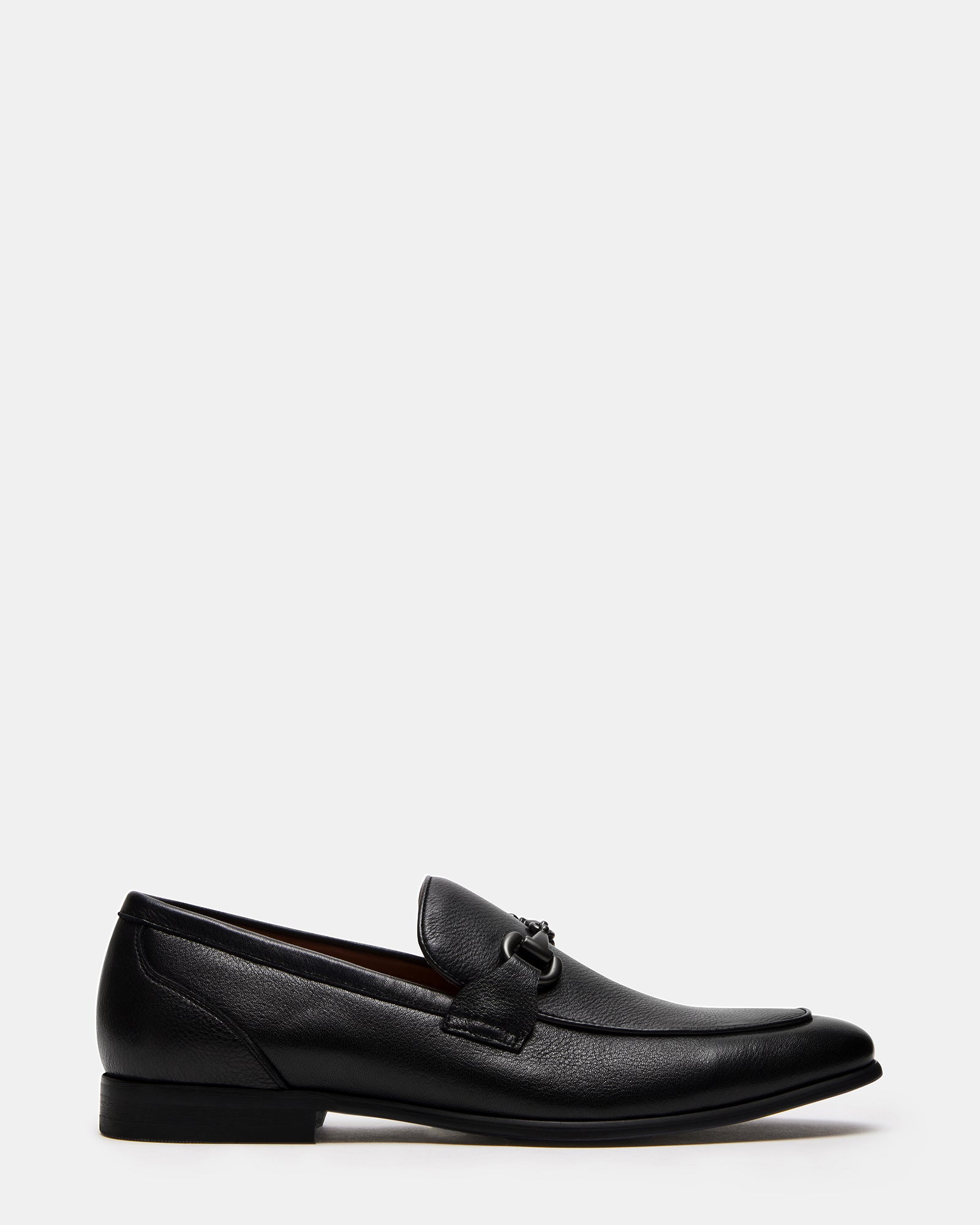 Jayshan black patent leather shoes shown with tailored suit pants