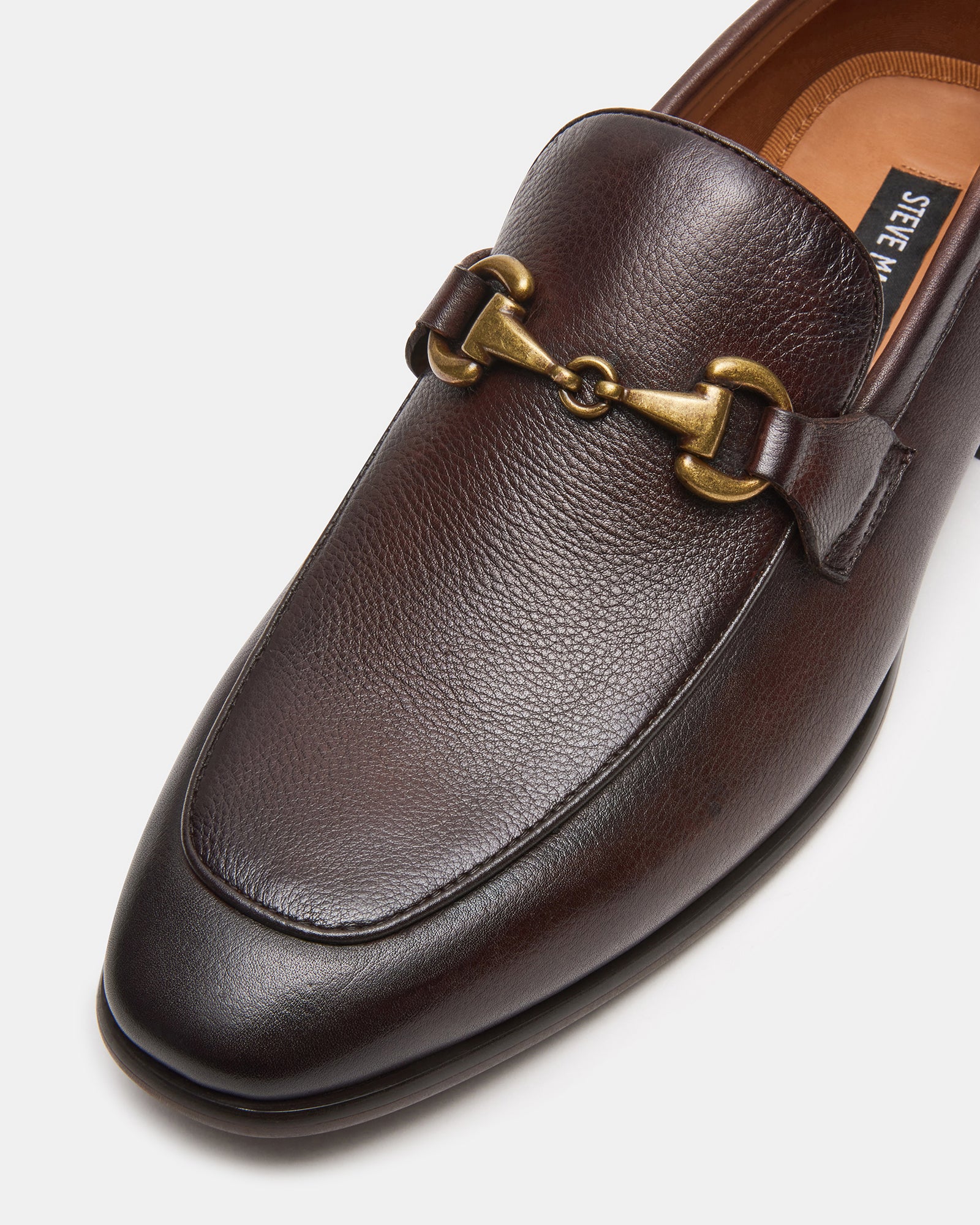 Top-down view showing polished bit detail and almond toe finish
