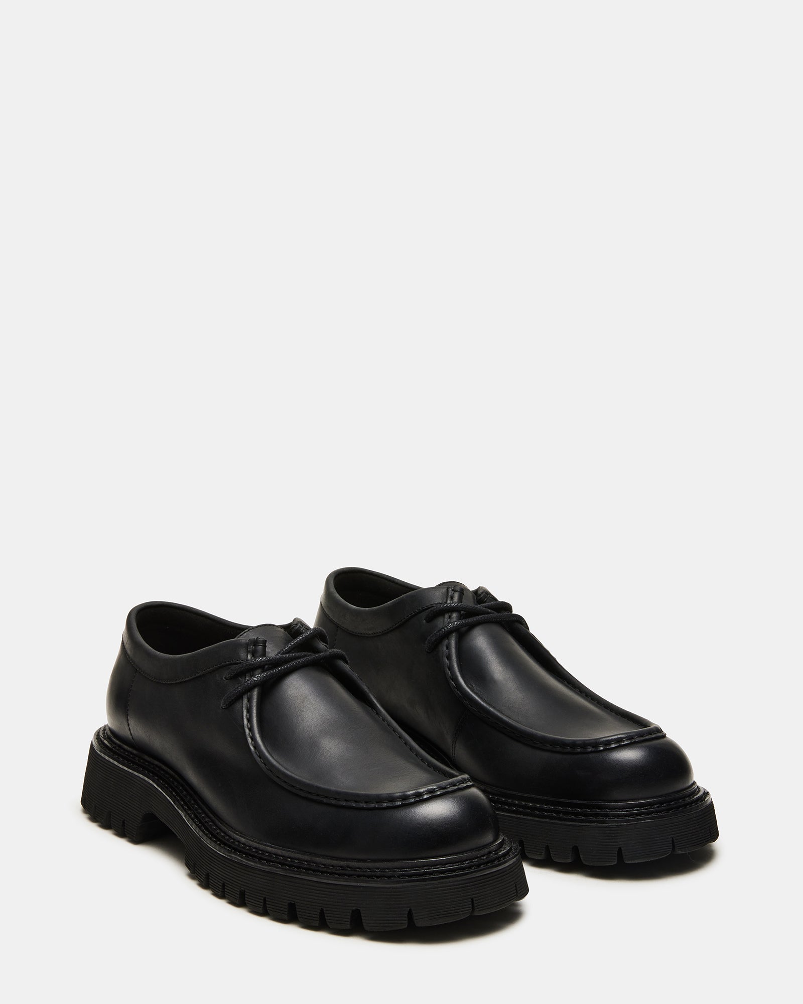 Close-up of the moc toe and chunky sole design on KALKIN dress shoes.