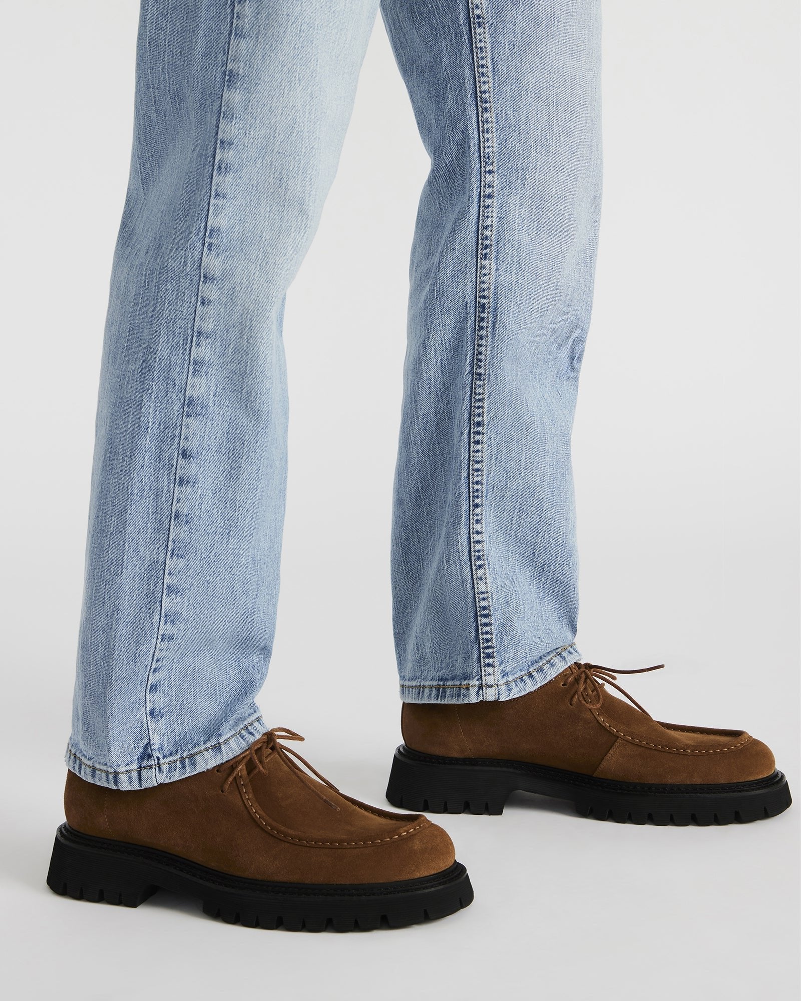 Side profile of KALKIN shoes, highlighting the lace-up fit and suede upper.
