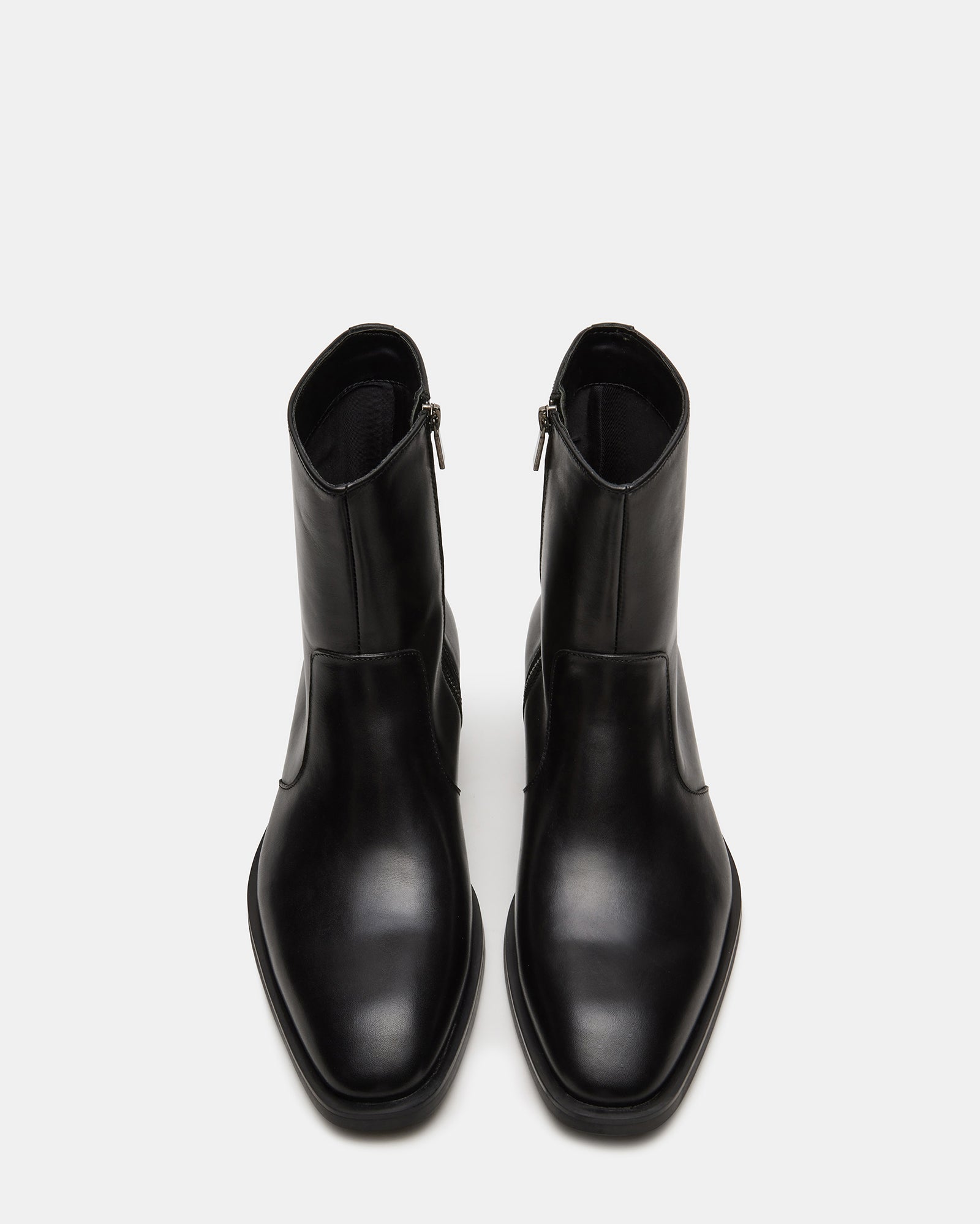 Side view of stylish black leather boots with a 1.25-inch heel for women and men