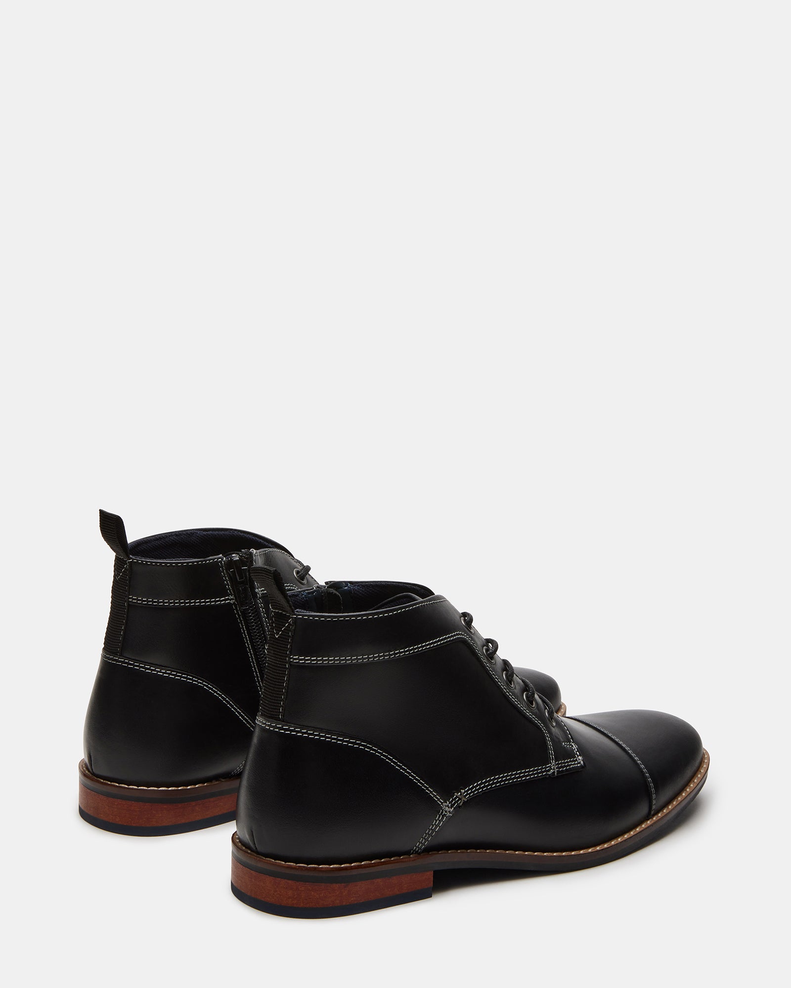 Side view of stylish boots with 1-inch heel and cap toe