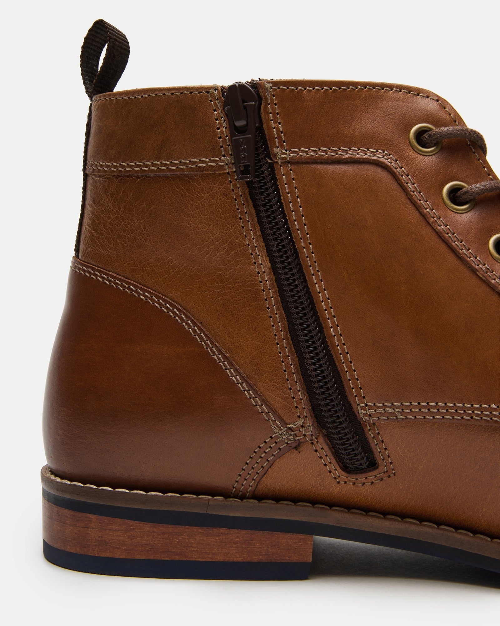Side view of mens chelsea boots in brown leather with zip
