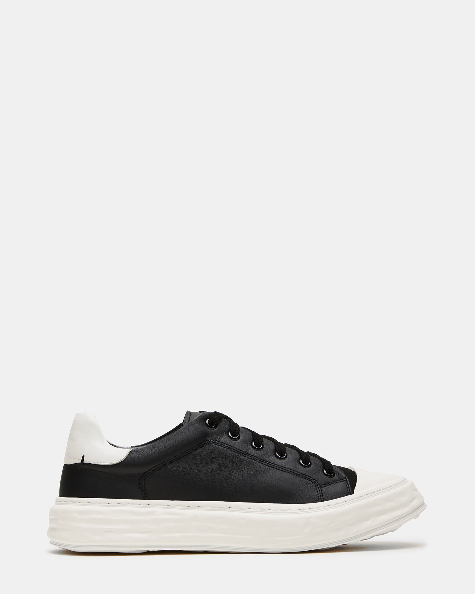 Side view of Macrae black leather sneakers with stylish cap toe detail