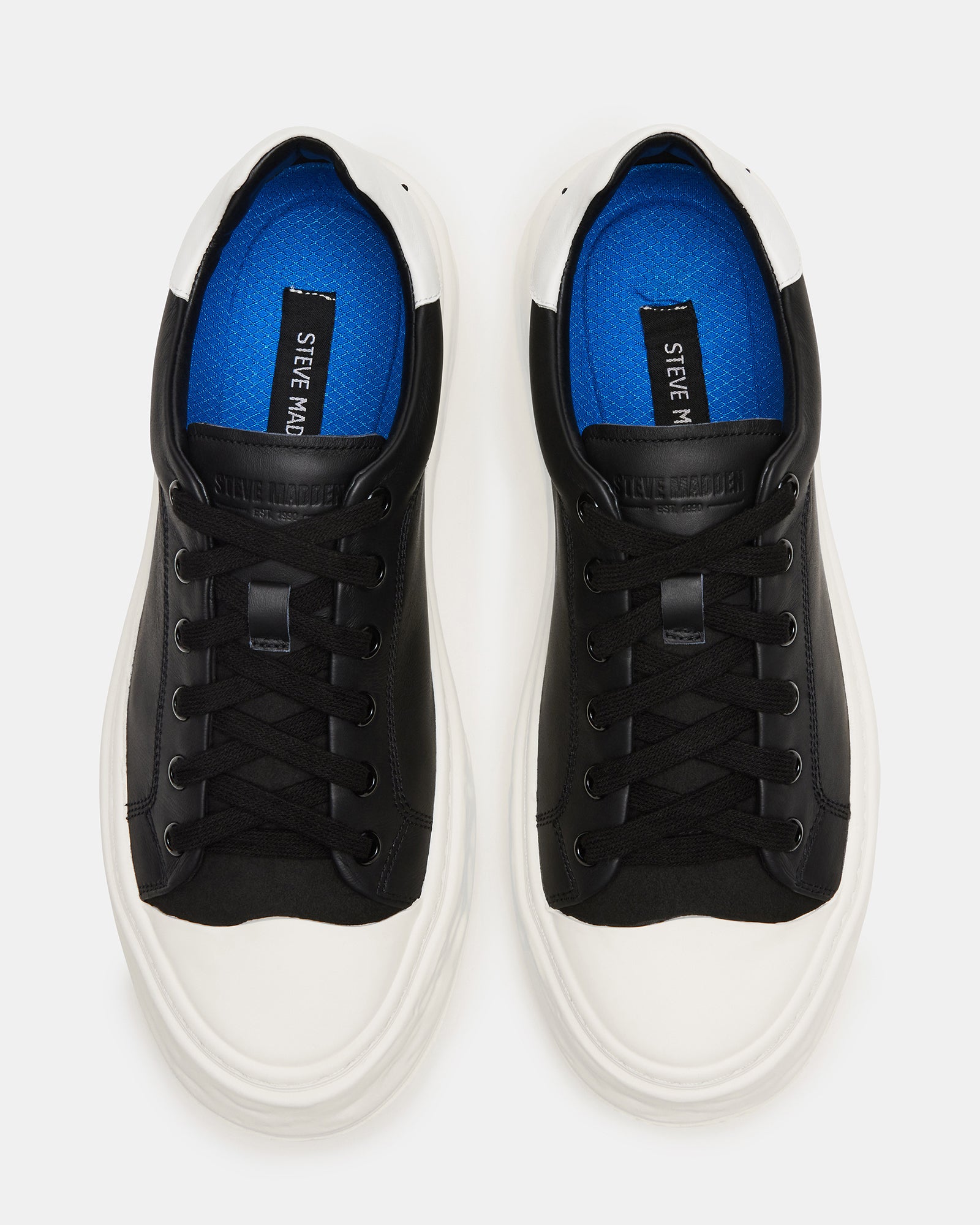 Side view of Macrae black leather sneakers with stylish cap toe detail