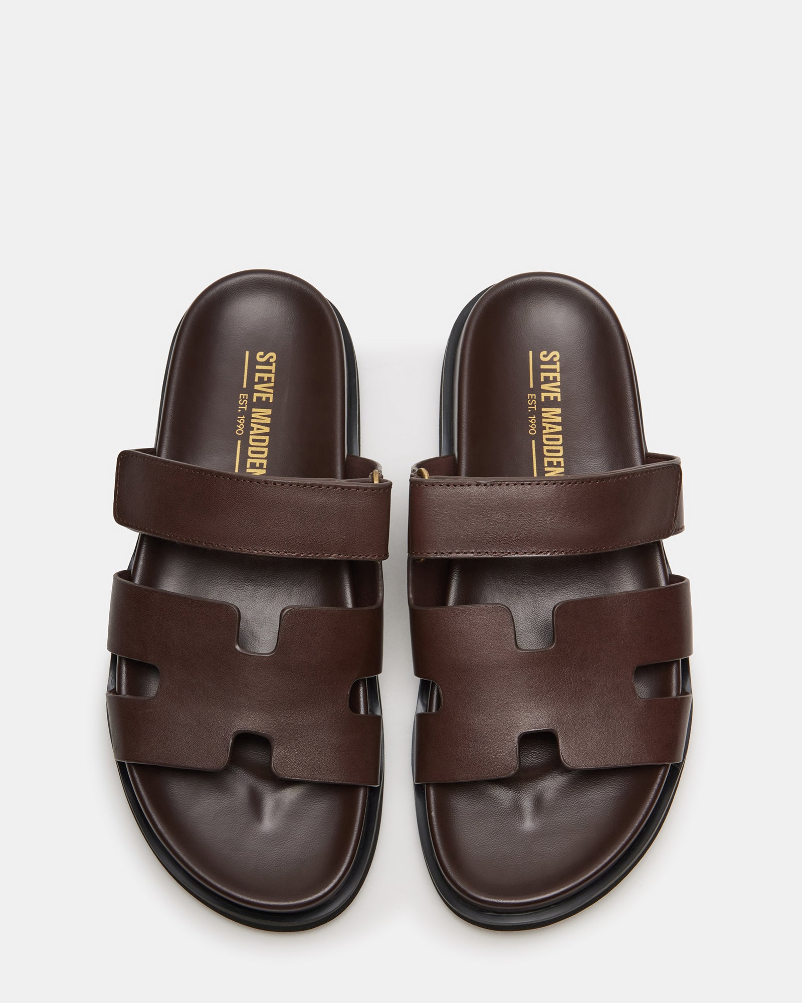Side view of MAIVEN sandals showcasing leather upper and heel height.