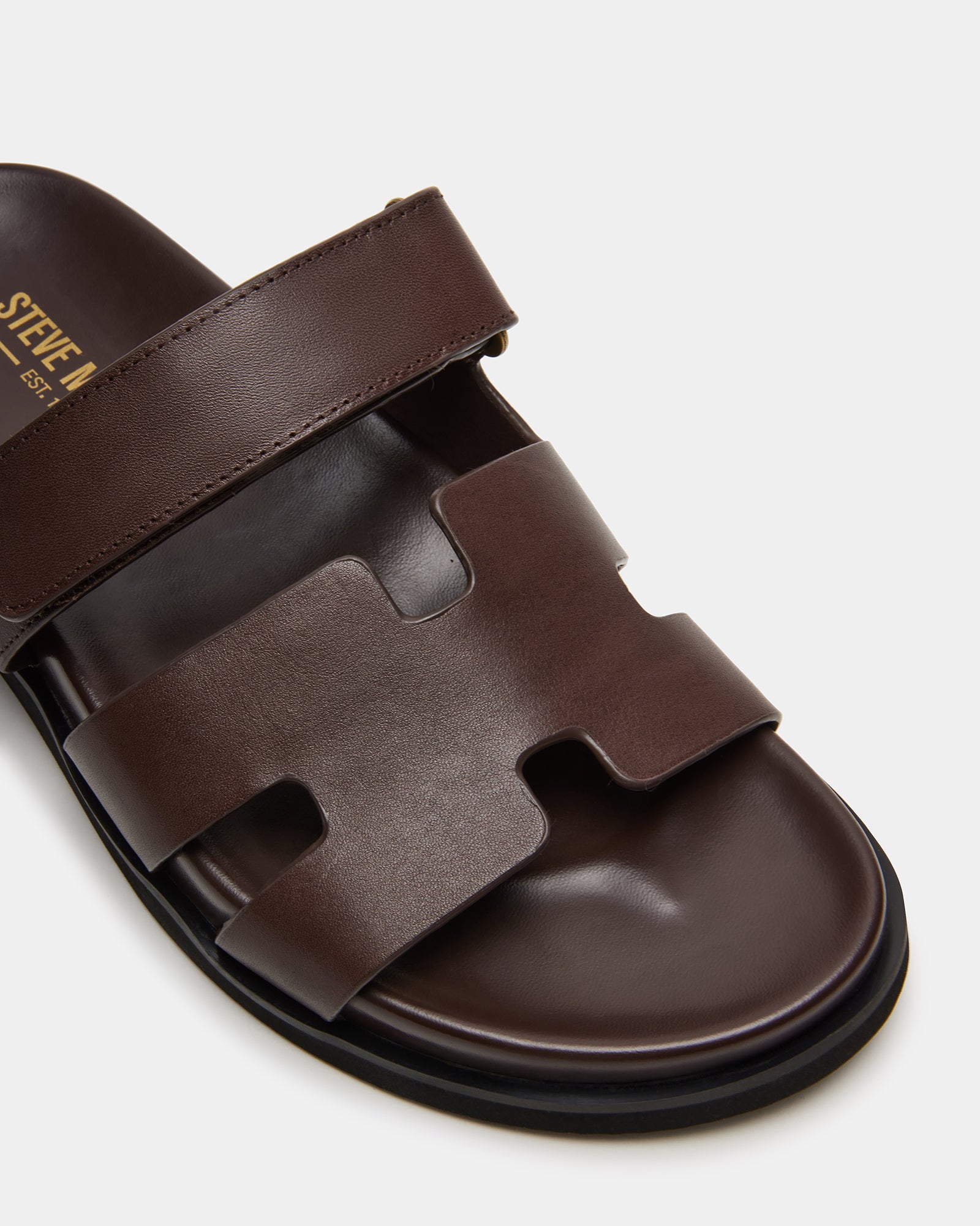 Close-up of MAIVEN sandals highlighting the textile lining and sole.