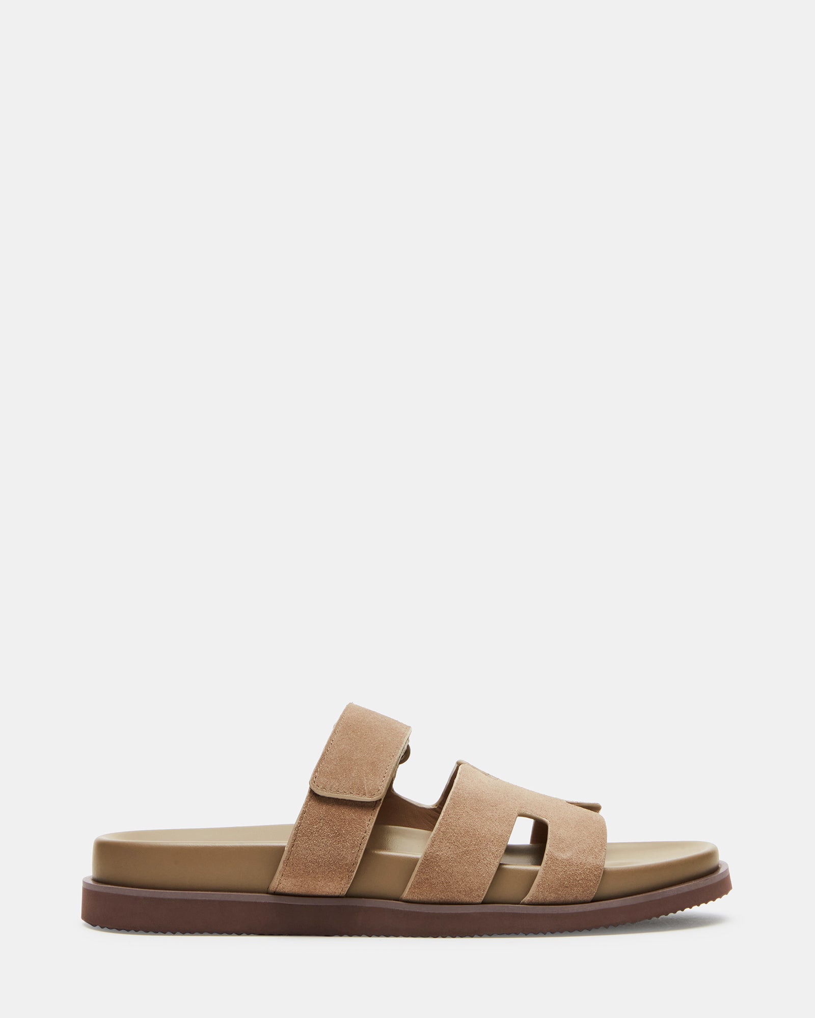Close-up of taupe suede sandals showcasing the soft material and stylish design.