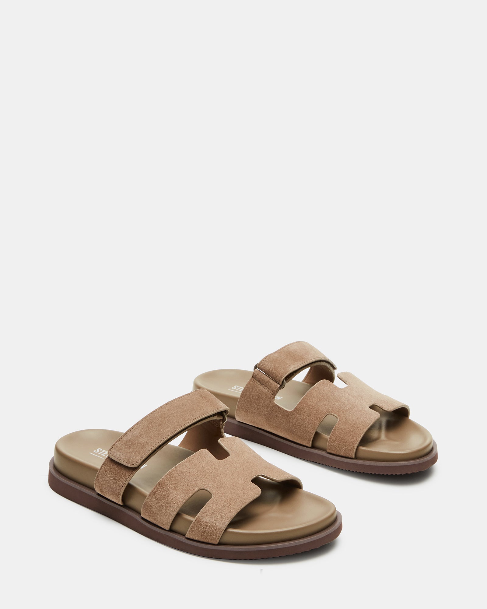 Flat lay of taupe suede sandals paired with summer outfits, perfect for casual outings.