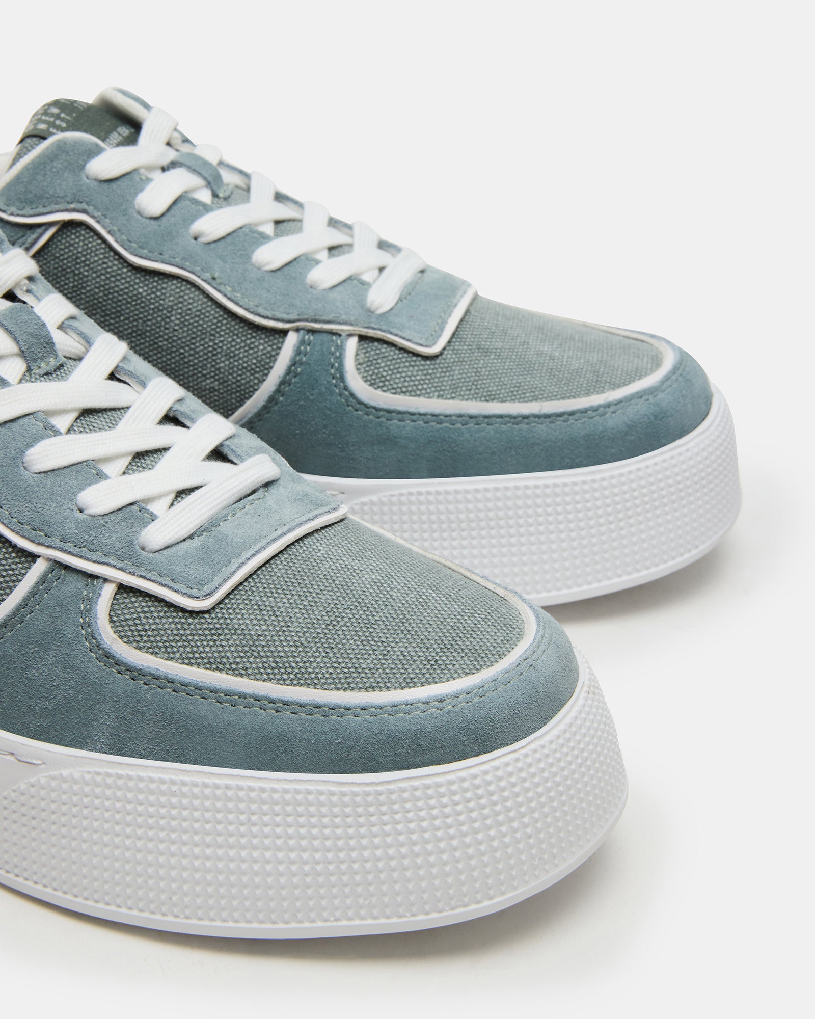 Close-up of the Mars Green Multi shoes, featuring the breathable mesh lining.