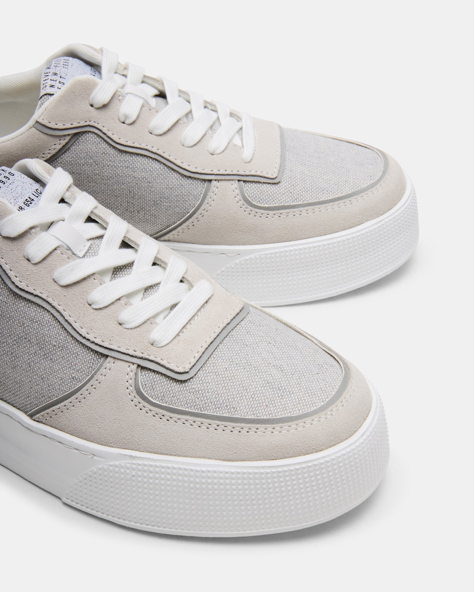 Mars Grey Multi fashion sneakers on a city street, complementing casual outfits.