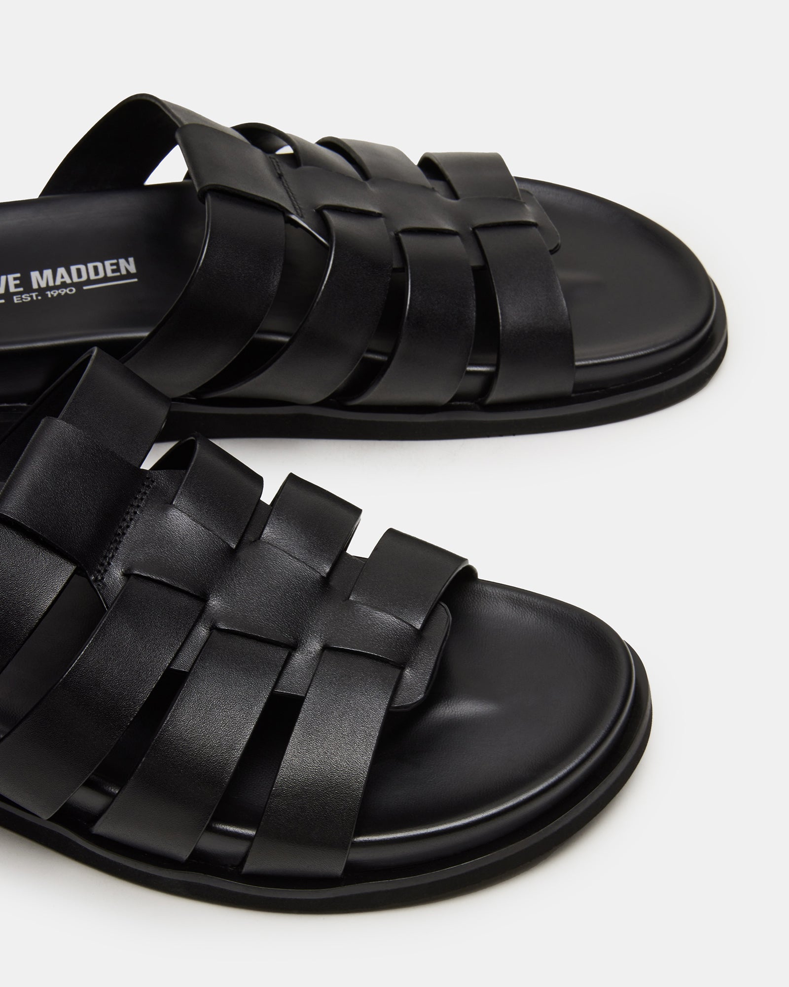 Side view showing the slide sandal’s footbed and heel height