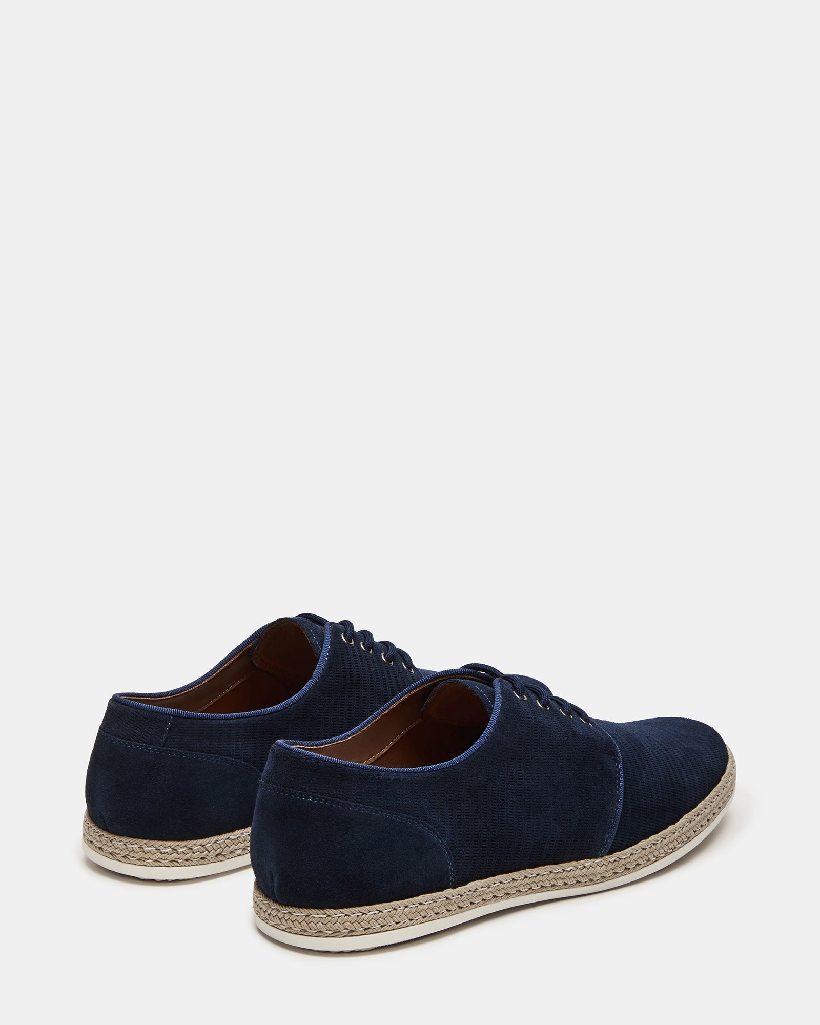 Styled view of Menorca Navy suede shoes paired with dress pants for a formal look